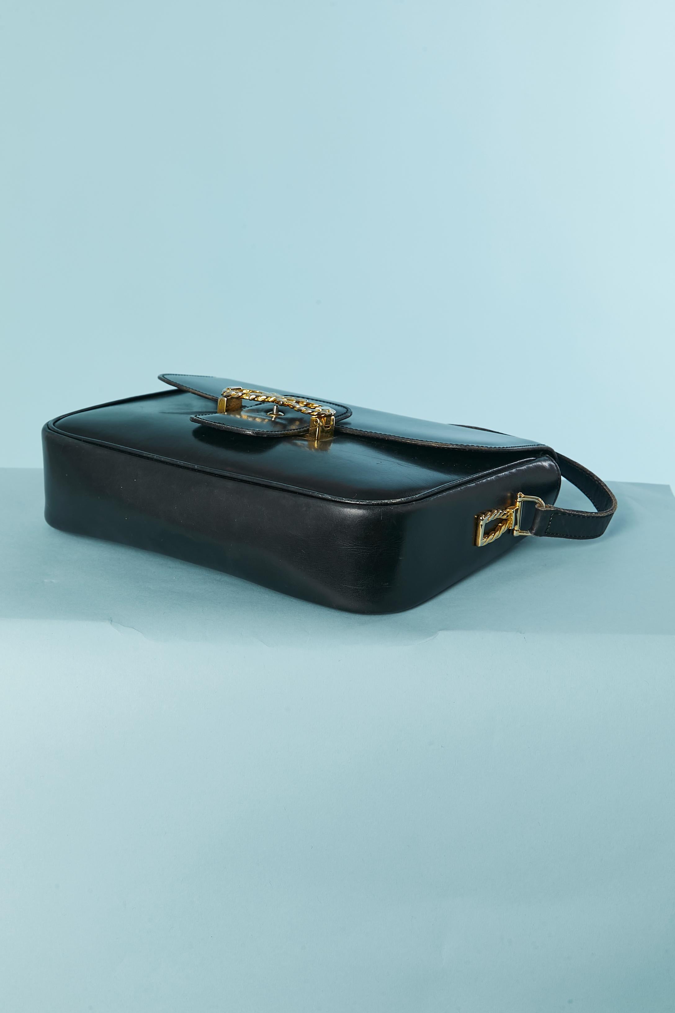 Women's Black leather shoulder bag with gold metal hardware Céline Circa 1970's For Sale