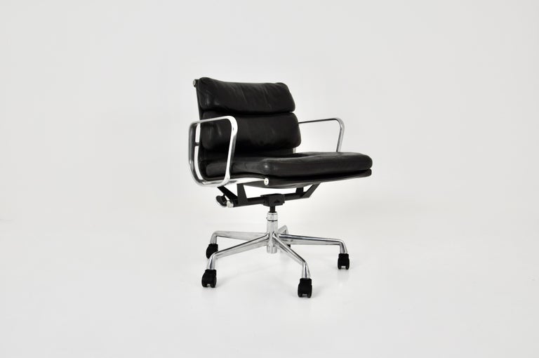 Black leather armchair with aluminium base and wheels. Dimensions: Seat height 49cm Wear due to time and age of the chair.