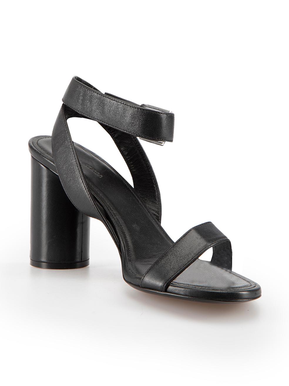 CONDITION is Very good. Minimal wear to sandals is evident. Minimal wear to both heels with very light indents to the leather on this used Balenciaga designer resale item.



Details


Black

Leather

Heeled sandals

Strappy

Wrap around adjustable