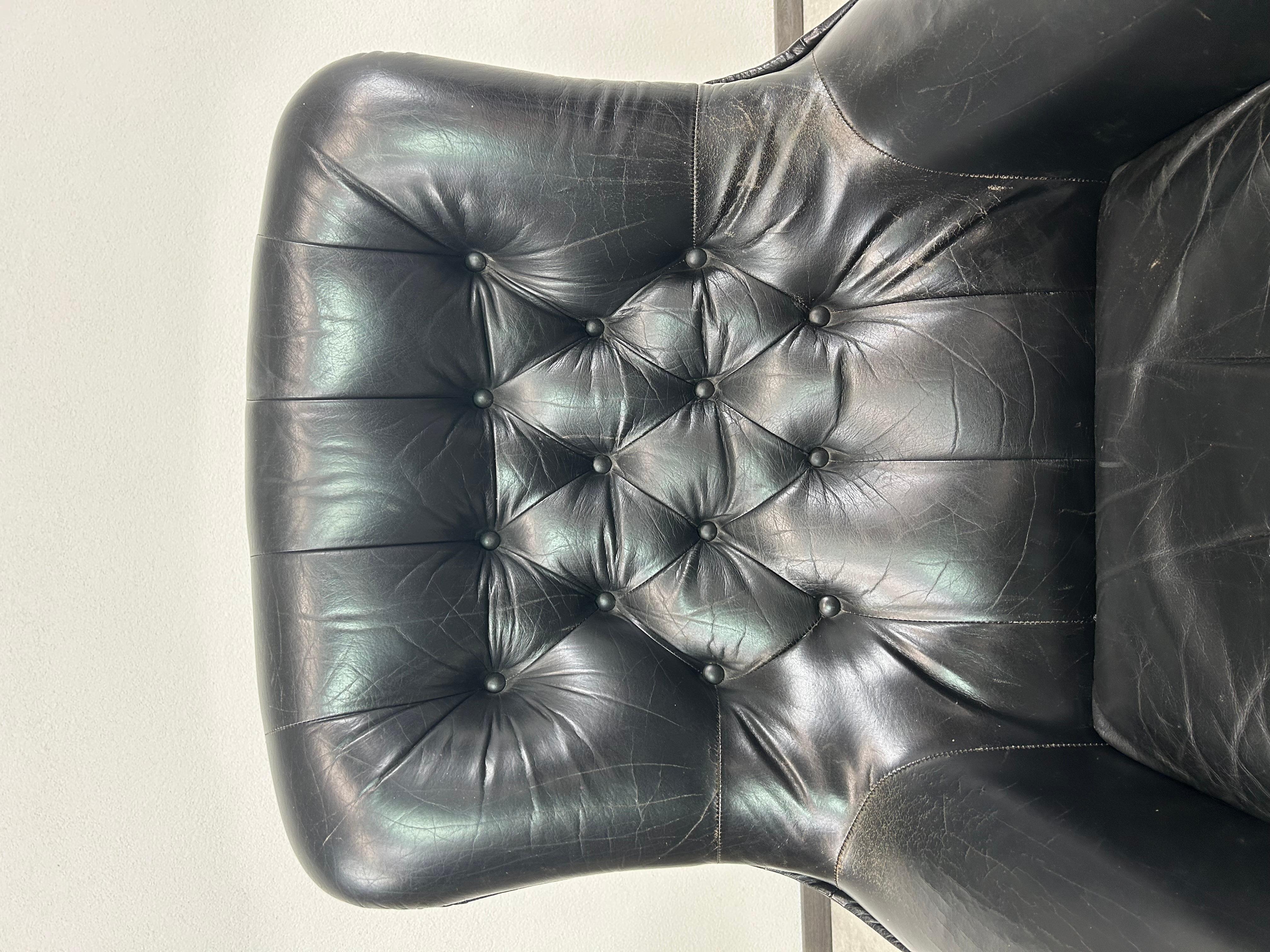 Austrian Black leather swivel wingchair by PeeM For Sale