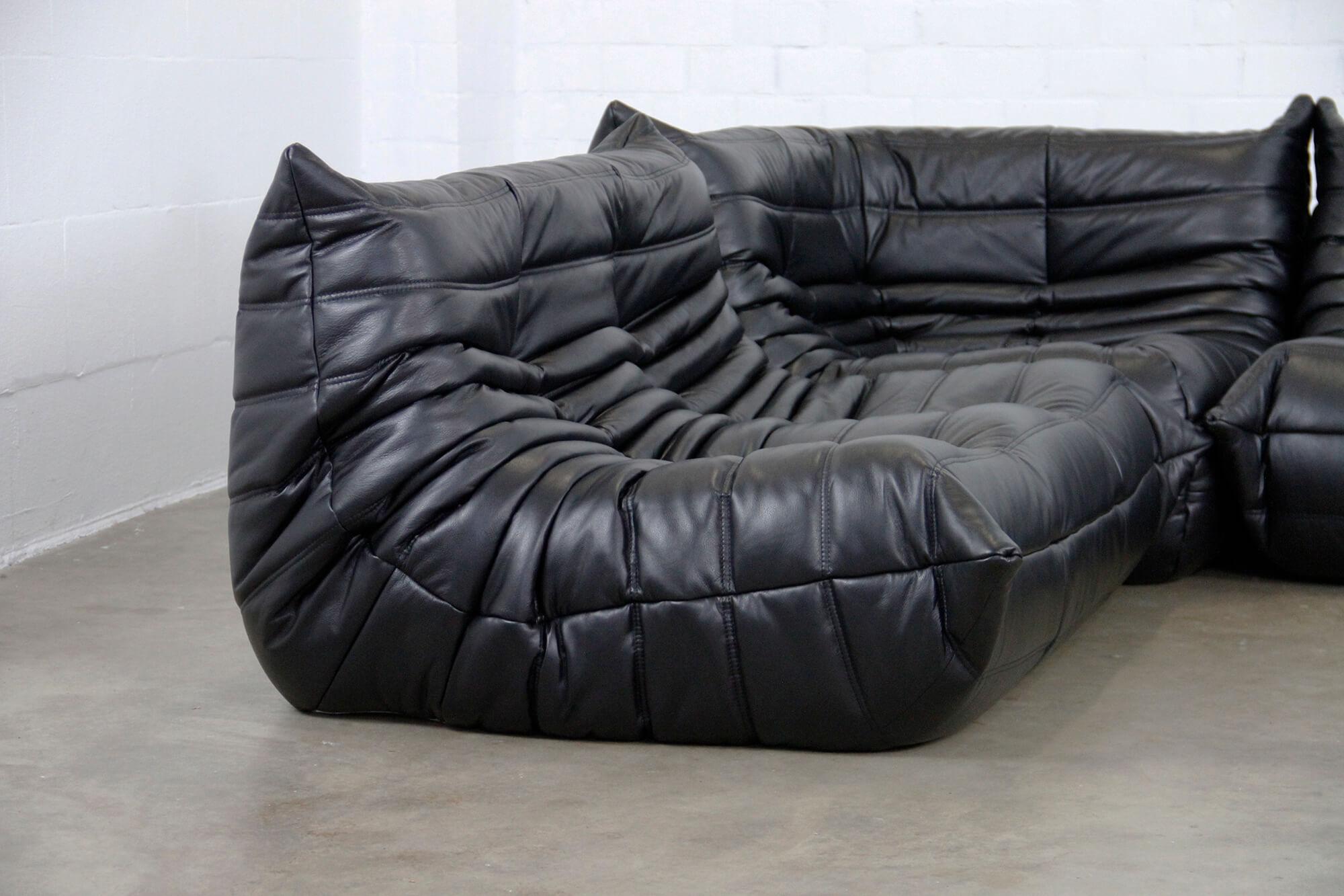 French seating designer Michel Ducaroy (1925-2009) is best known for his iconic, pop art-inspired Togo sofa.
This piece is reupholstered in a soft black leather.
 