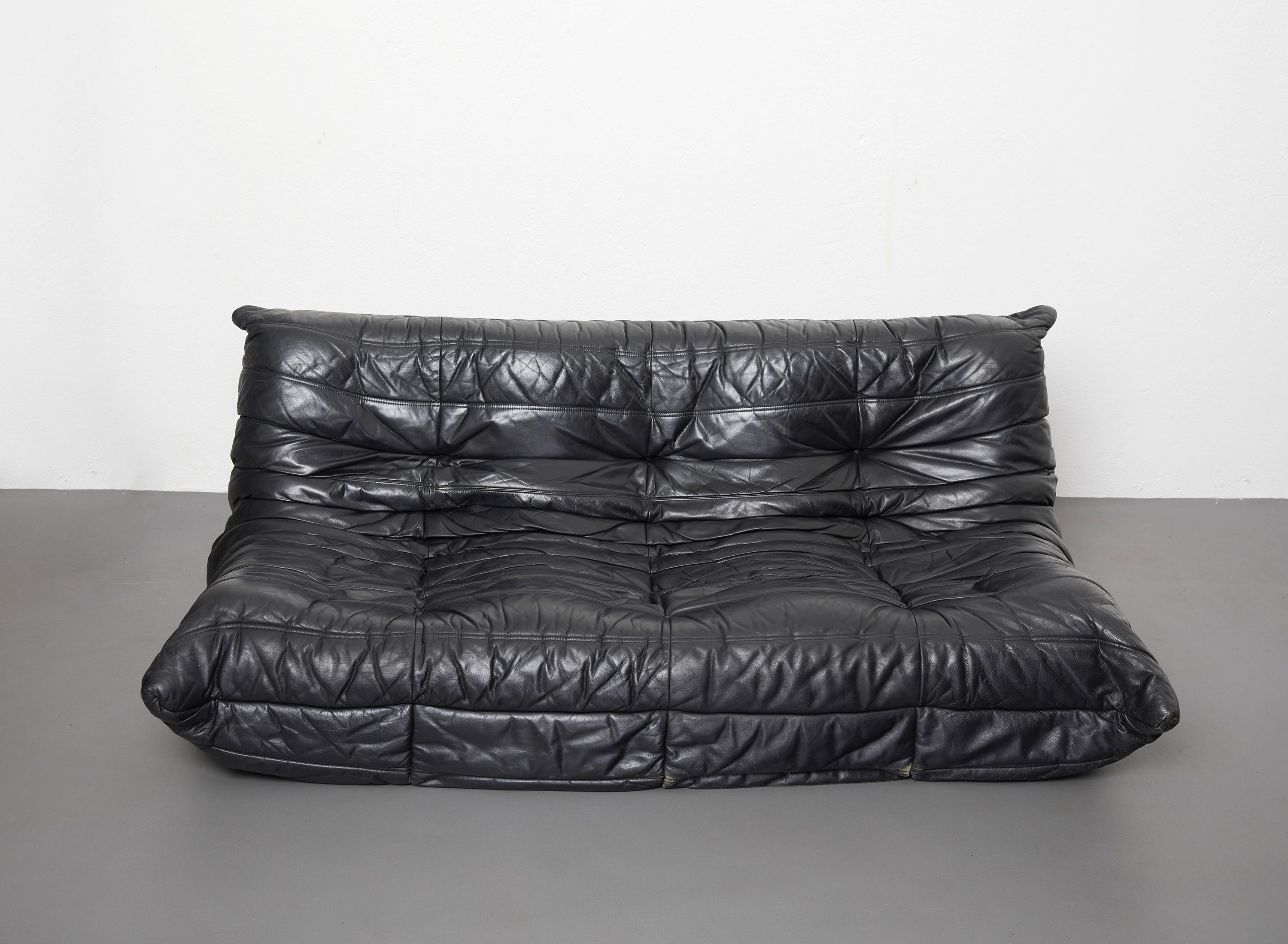 Black leather togo set, 2 and 3 seater, Michel Ducaroy by Ligne Roset 1973

Set of two iconic Ligne Roset Togo sofas: one three seater and one two seater. 
These sofa are known for their outstanding seating comfort

Beautiful black leather,