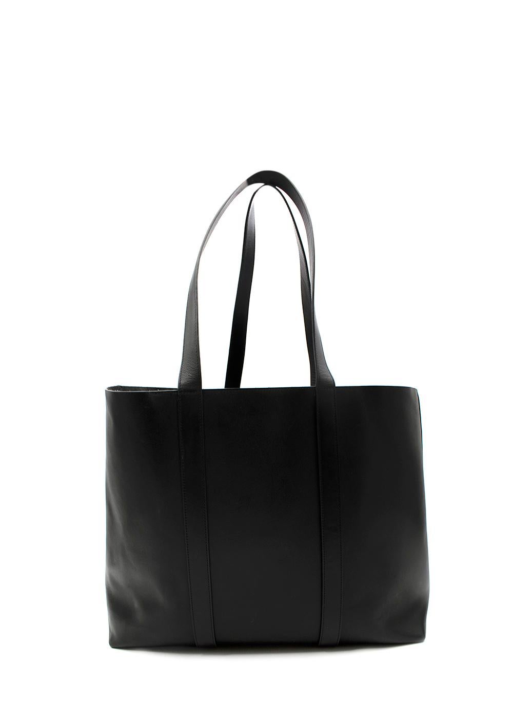 Mansur Gavriel Black Leather Tote Bag

- Clean and minimalist large spacious tote bag
- Two top handle and shoulder straps
- Charcoal grey suede interior with one large slip pocket 

Materials
Leather
Suede

Made In Italy

PLEASE NOTE, THESE ITEMS