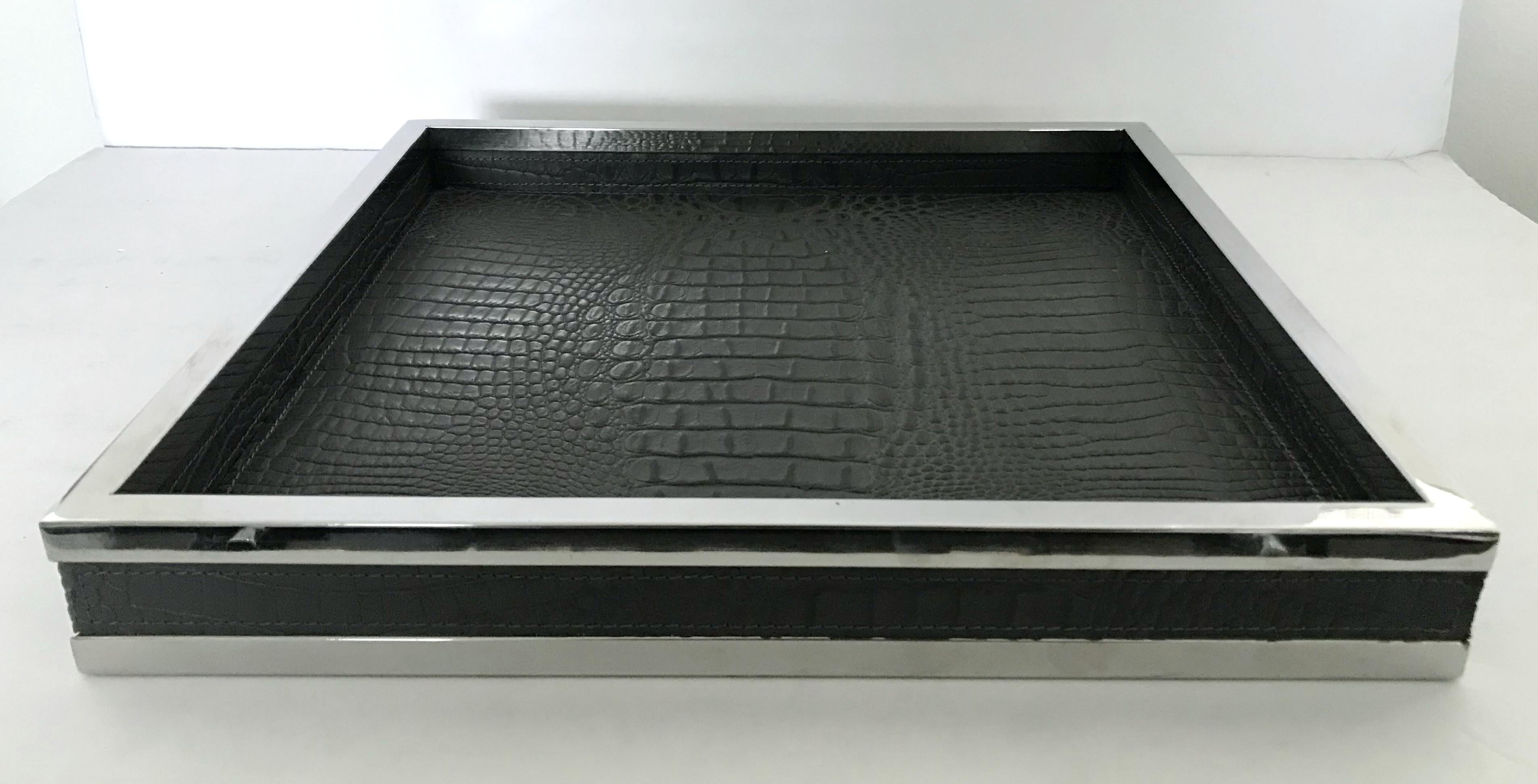 Black leather with pressed crocodile effect and stainless steel tray / Made in Italy
Measures: Length 14 inches, width 14 inches, height 2 inches
1 in stock in Palm Springs ON 20% OFF SALE for $799 !!!
Order reference #: FABIOLTD F224
This piece