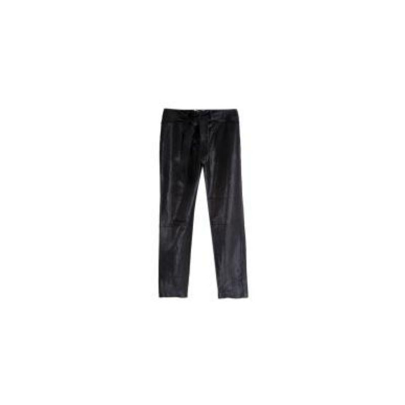 Saint Laurent Black Leather Waisted Trouser
 
 - Lambskin leather straight leg trousers
 - Silver tone zip and hook and eye fastening at the fly 
 - Self tie belt along the waistband 
 - Pockets on either side at both the front and back 
 - Silk
