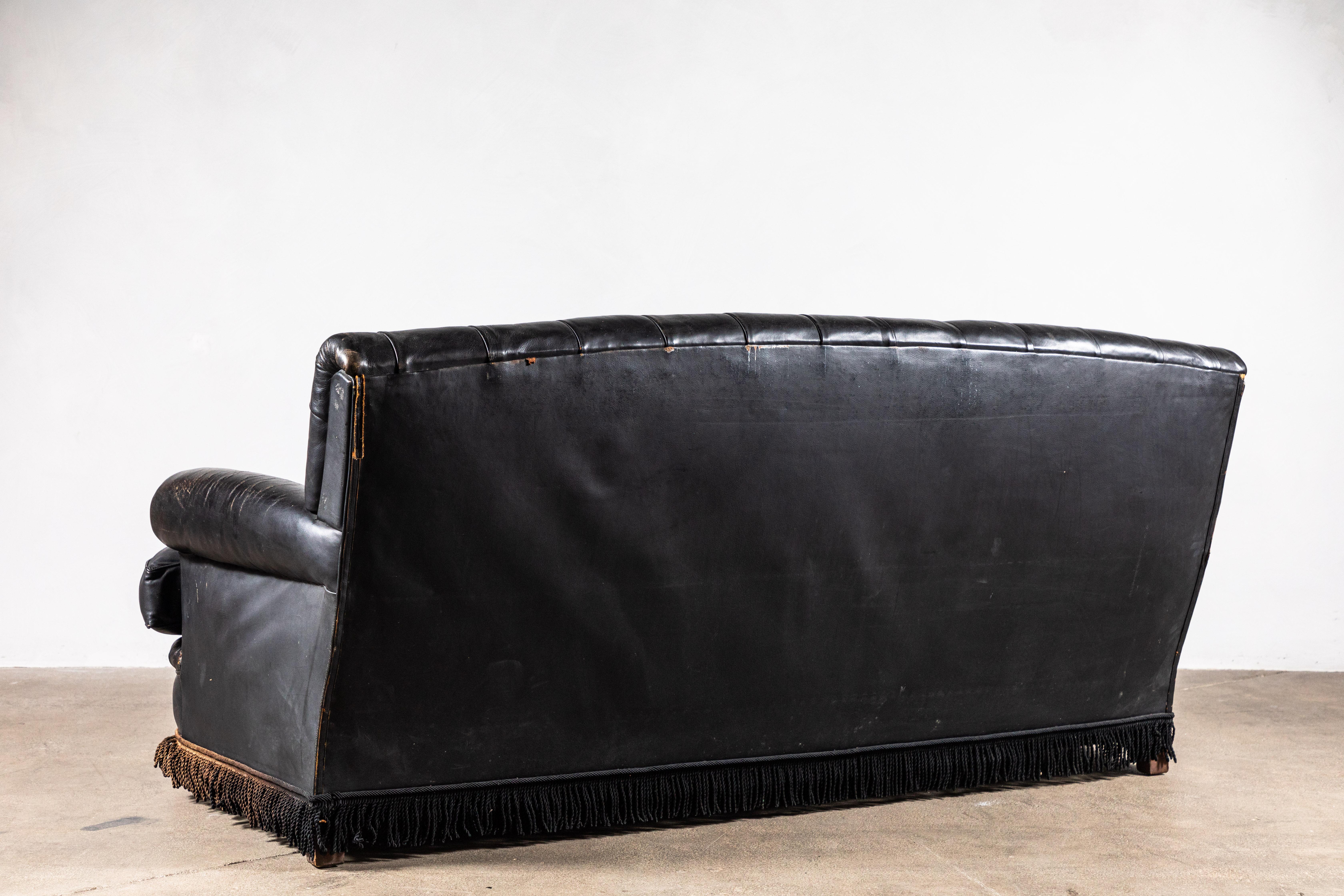 black leather tufted couch