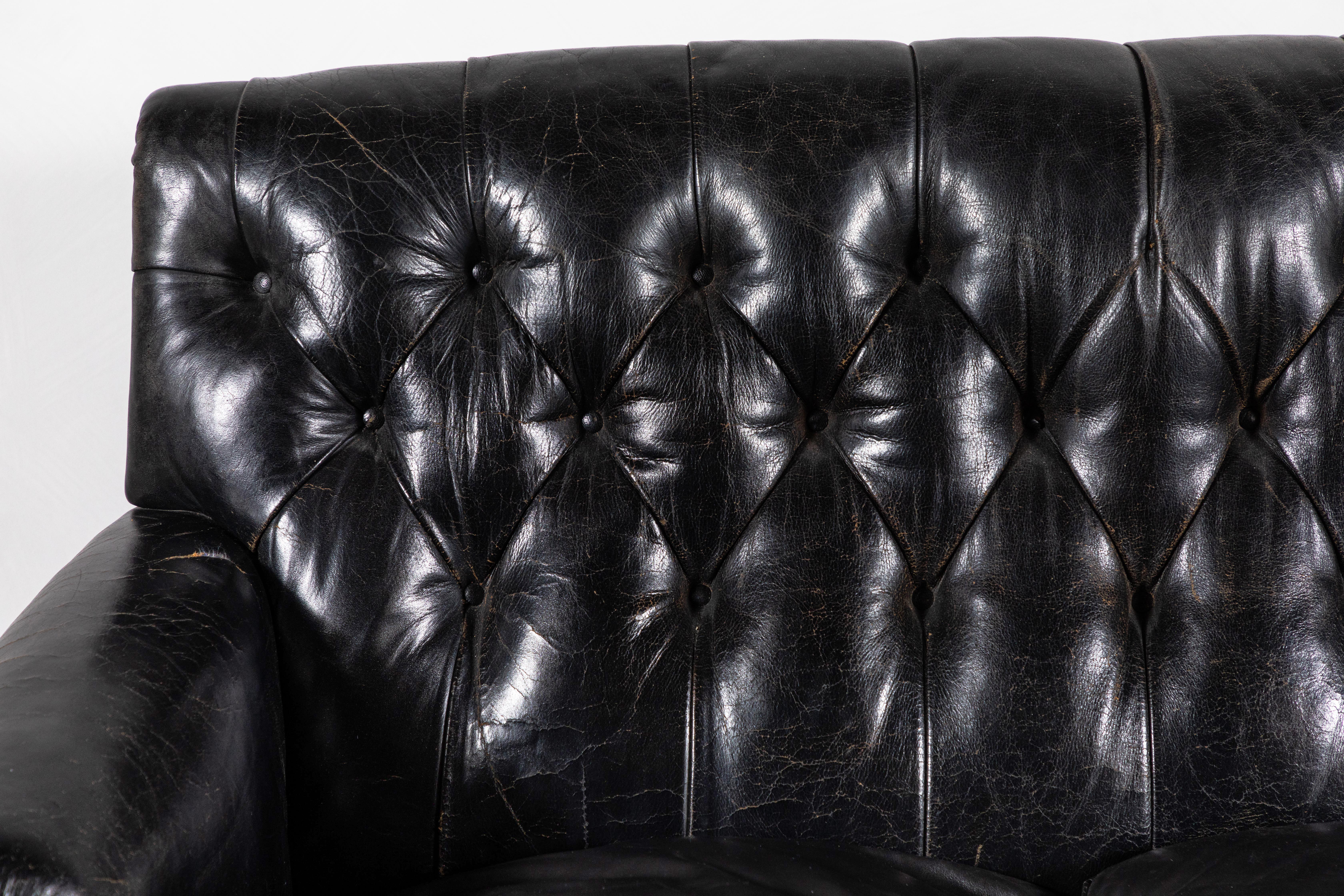 Mid-20th Century Black Leather Tufted Sofa with Tufting and a Fringed Base
