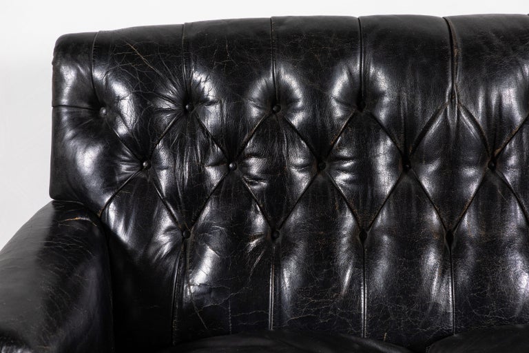 Black Leather Tufted Sofa with Tufting and a Fringed Base at 1stDibs