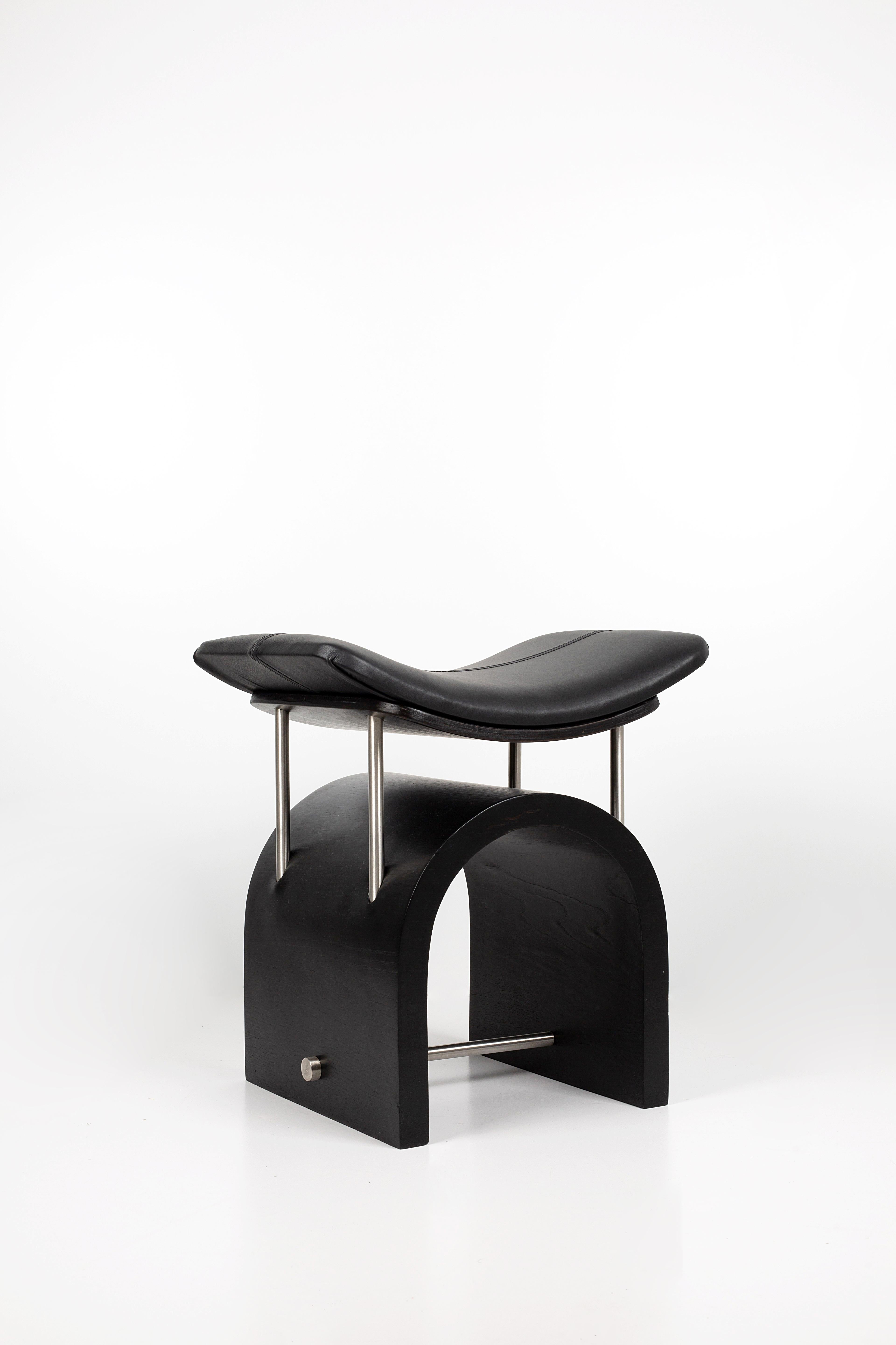 Black leather wing stool by Studio Laf
Dimensions: L 43 cm x W 35 x H 44 cm
Materials: Plywood, stainless steel, leather
Structure: Black plywood
Available: different colours leather: Brown, black, antique brown, cherry red.


It emerged with