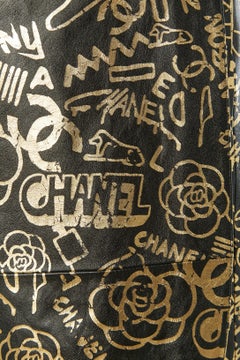 Black leather wrap dress with gold print CHANEL Métiers d'Art Egyptomania 2018