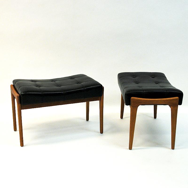 A lovely pair of teak and black leatherette taburettes made by Bröderna Andersson Ekenässjön AB, Sweden, 1950s. Practical in every occasion both as an extra chair or a foot stool to rest your legs. Decorated with black buttons on the top. Soft and