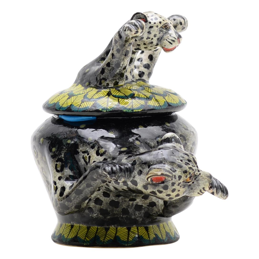 This Black Leopard Jewelry Box was hand sculpted by the renowned artisan Sondelani Ntshalintshali and beautifully painted by Swelihle Khanyeza both from South Africa. This exquisite ceramic creation stands 0 inches high, measuring 5 inches in length