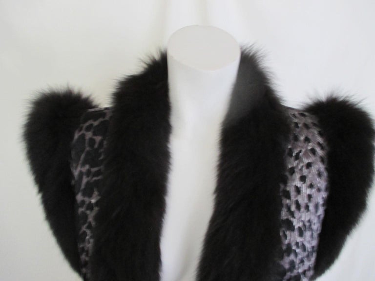 Sleeveless silk vest with black fox fur is super light to wear and to travel with.

We offer more exclusive vintage fur items, view our frontstore

Details:
With 2 pockets, 4 buttons
Material is silk with black fox fur 
made by Voss, Germany.
Mint