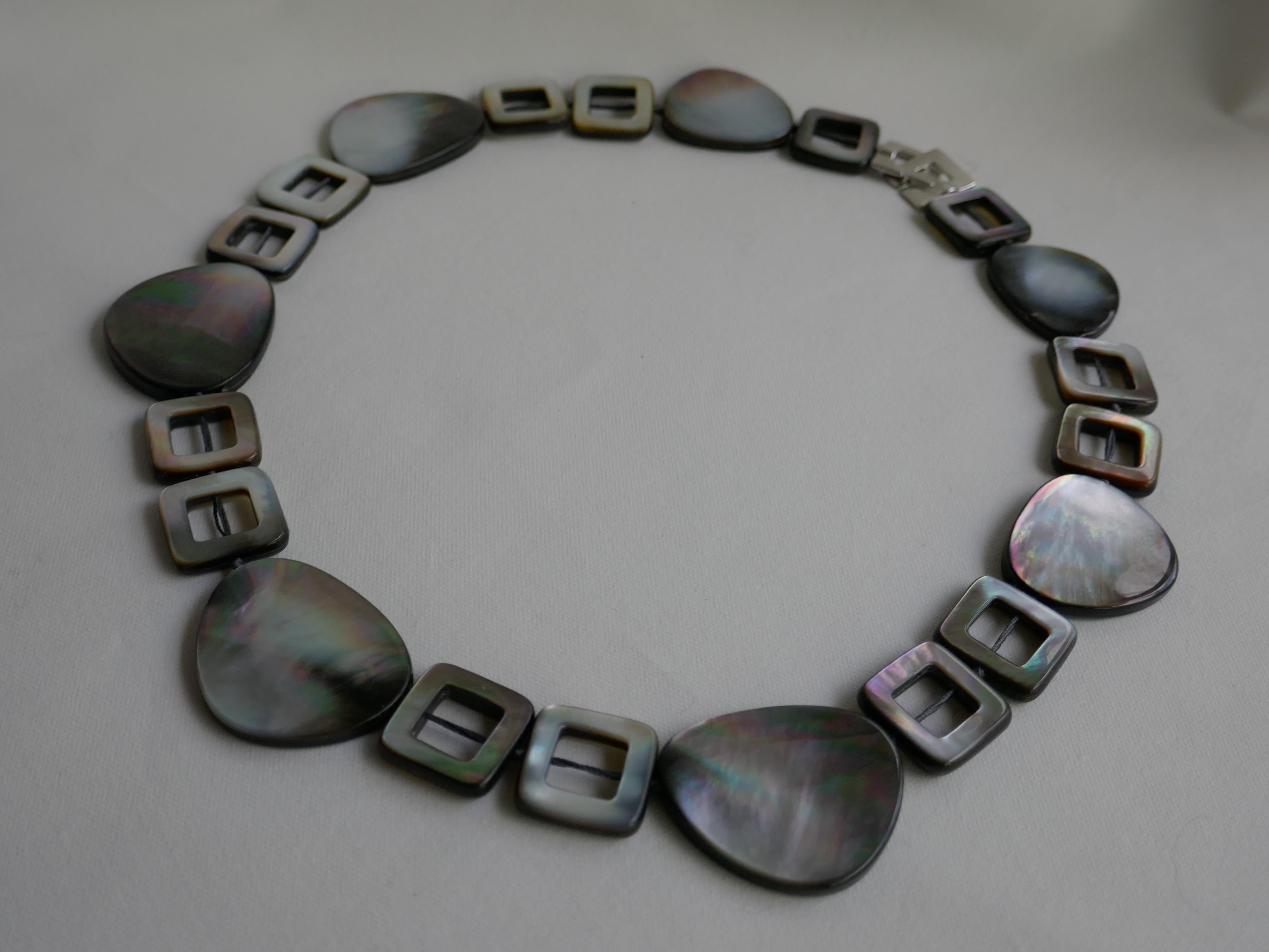 Black lip mother of pearl is beautiful. It Is very luminous and the pieces pick  up on the colors you are wearing. A very wearable piece year round. From what I have seen, black lip mother of pearl look amaz1ng on most skin tones and goes with most