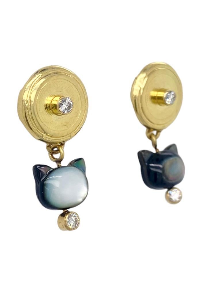 Hand-carved Mother of Pearl and Black Lip Mussel shell in the shape of a cat's head with 18k yellow gold and four .10ct diamonds.


Inspired by my recent sailing travels.
“The purpose of jewelry is not just for adornment. There’s information in it