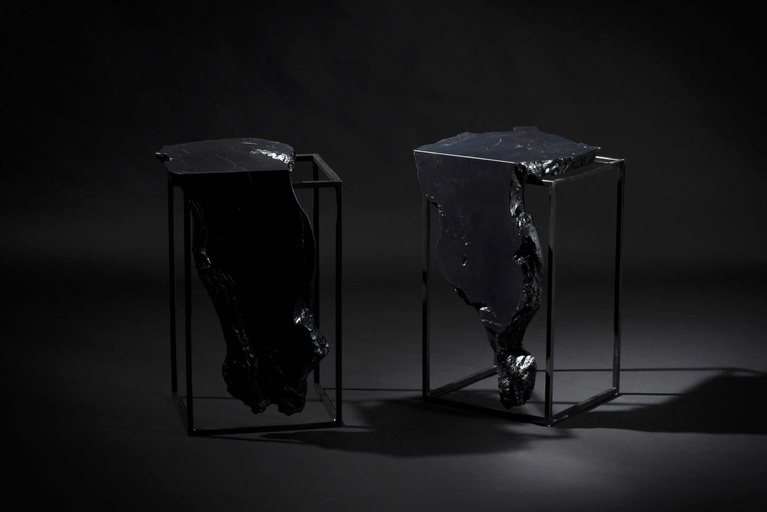 The Mack side tables are made of solid oxidized black maple live edge slabs with a charred black finish, set on top of black steel bases. These tables can fit a wide variety of styles and will be a unique addition to any room. In the proper space,