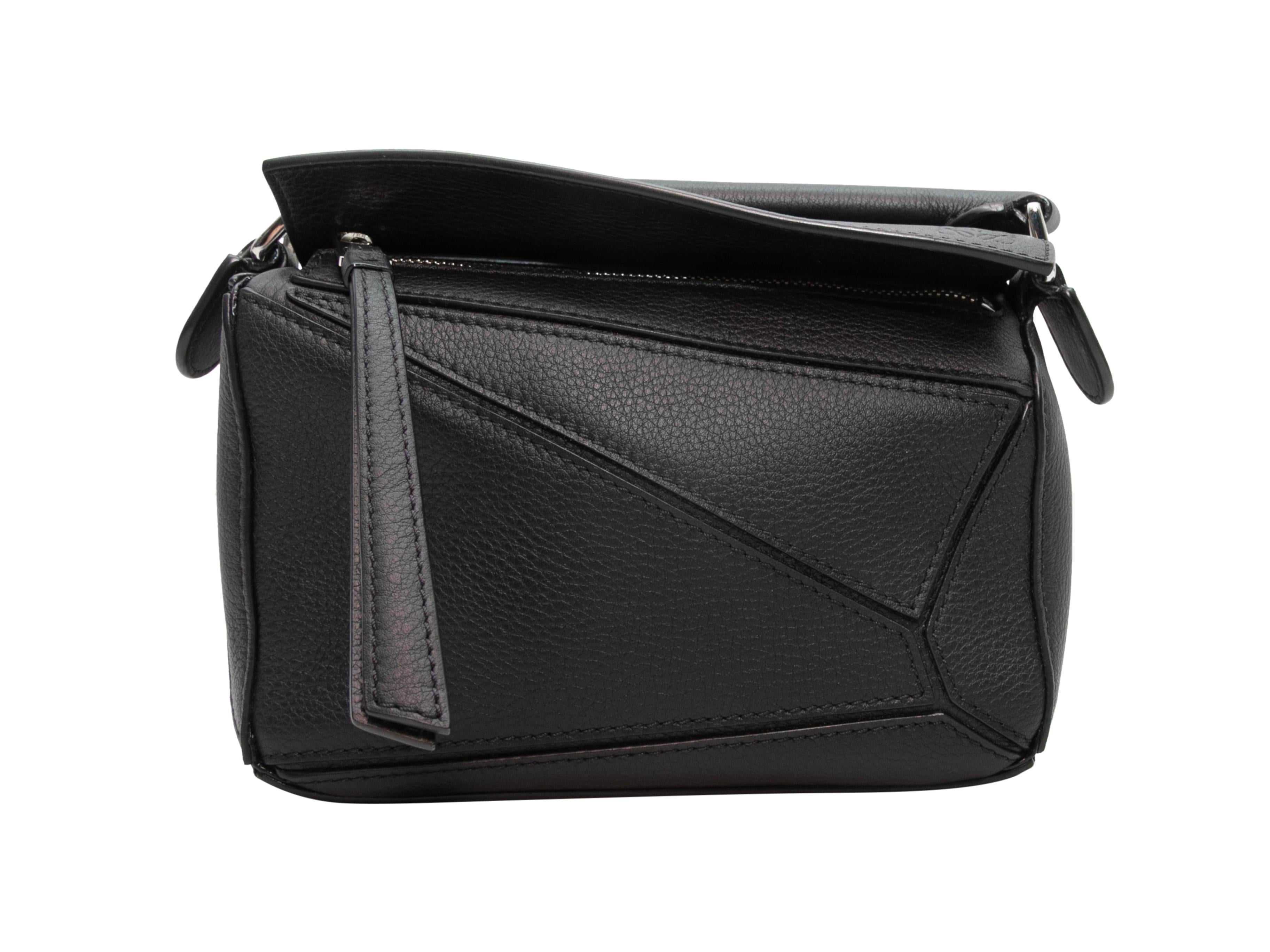 Black Loewe Mini Leather Puzzle Crossbody Bag. The Mini Puzzle Crossbody Bag features a leather body, silver-tone hardware, a single flat top handle, a single flat crossbody strap, and a top zip closure. 7