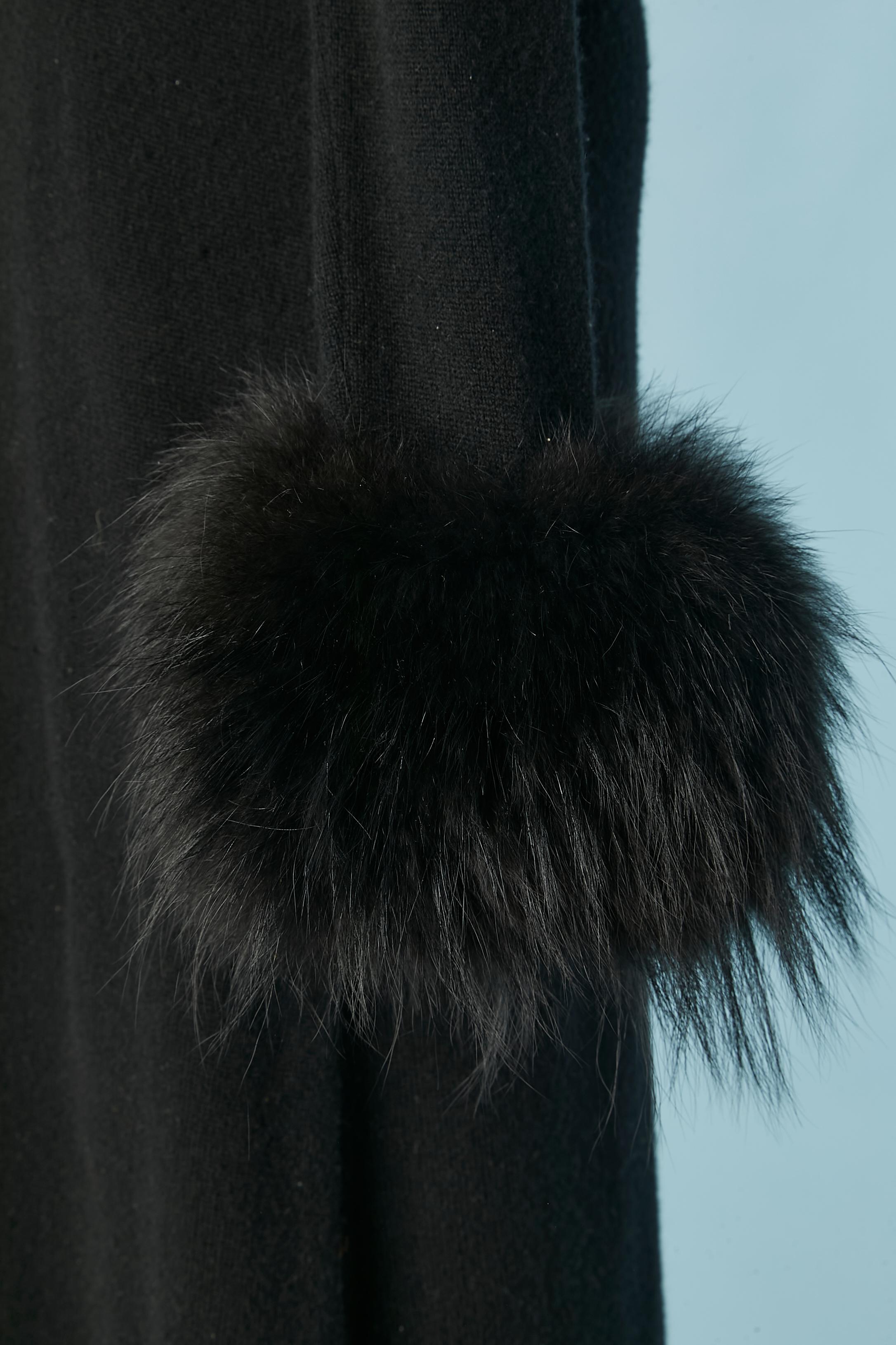Black long cashmere knit dress with furs cuffs, detachable with snaps. Black satin lining under the fur.  No indication about the kind of fur but it's probably fox. 
SIZE M 