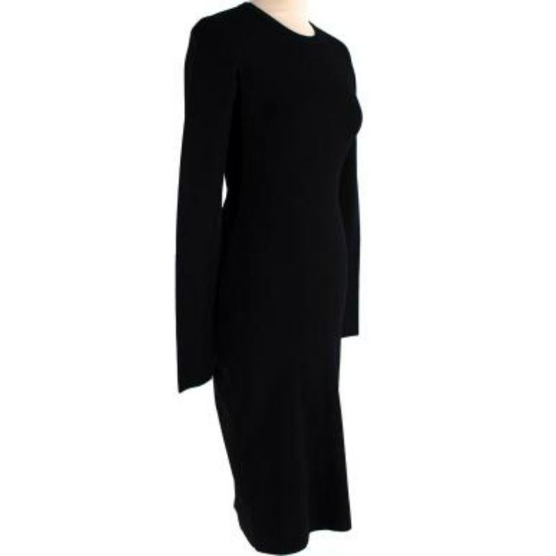 Stella McCartney black long sleeve open back dress
 
 
 
 -Silver tone rear zip fastening 
 
 -Back cut out detail 
 
 -Round neck 
 
 -Ribbed neckline 
 
 -Slim fit 
 
 -Mid weight with slight stretch 
 
 
 
 Material: 
 
 
 
 83% Rayon 
 
 17%
