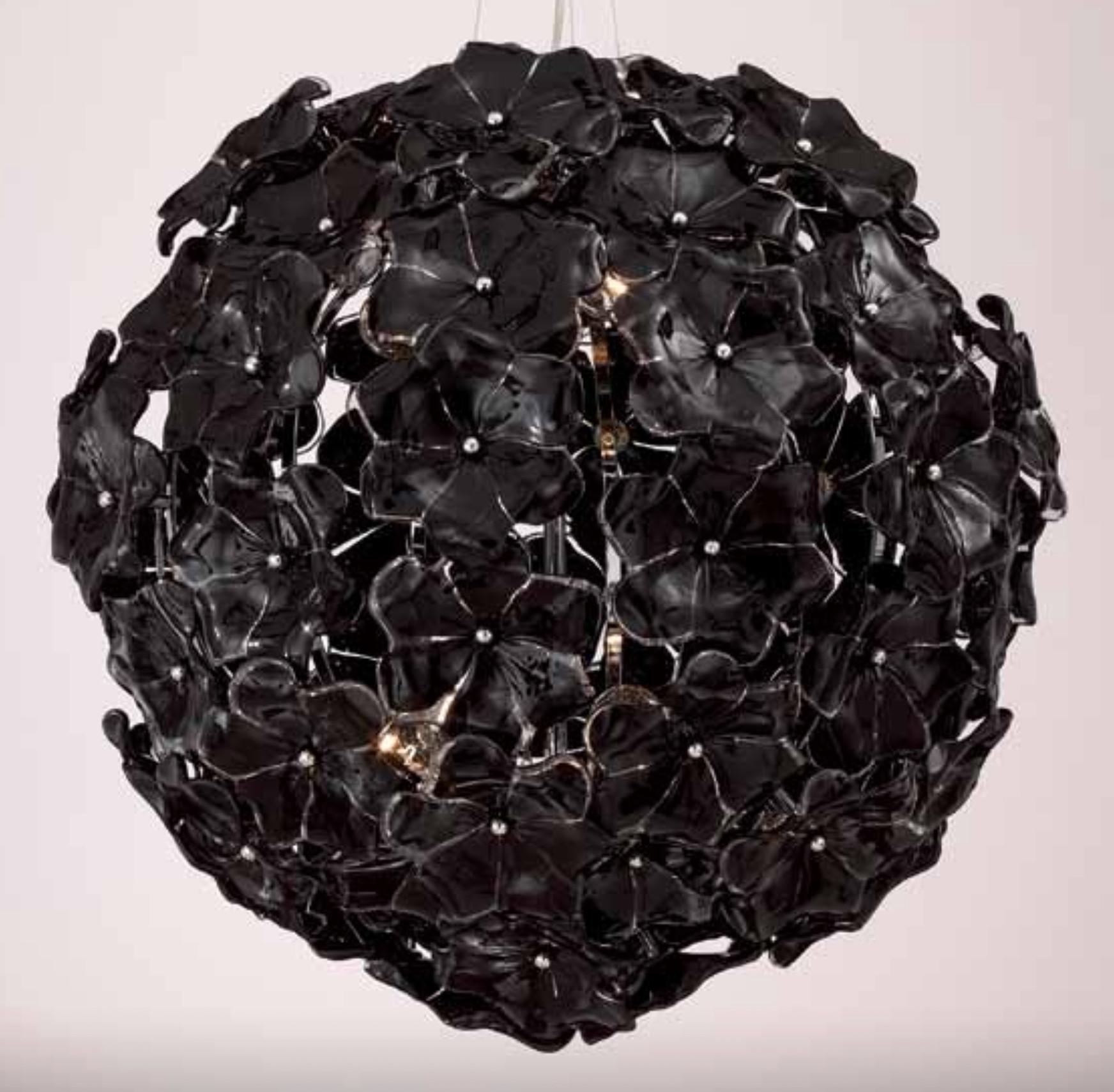 Italian chandelier with layered hand blown black Murano lotus flowers mounted chrome spherical structure / Made in Italy in the style of Cenedese
Measures: diameter 23.5 inches, height 23.5 inches plus cables and canopy
10 lights / E12 or E14 type /