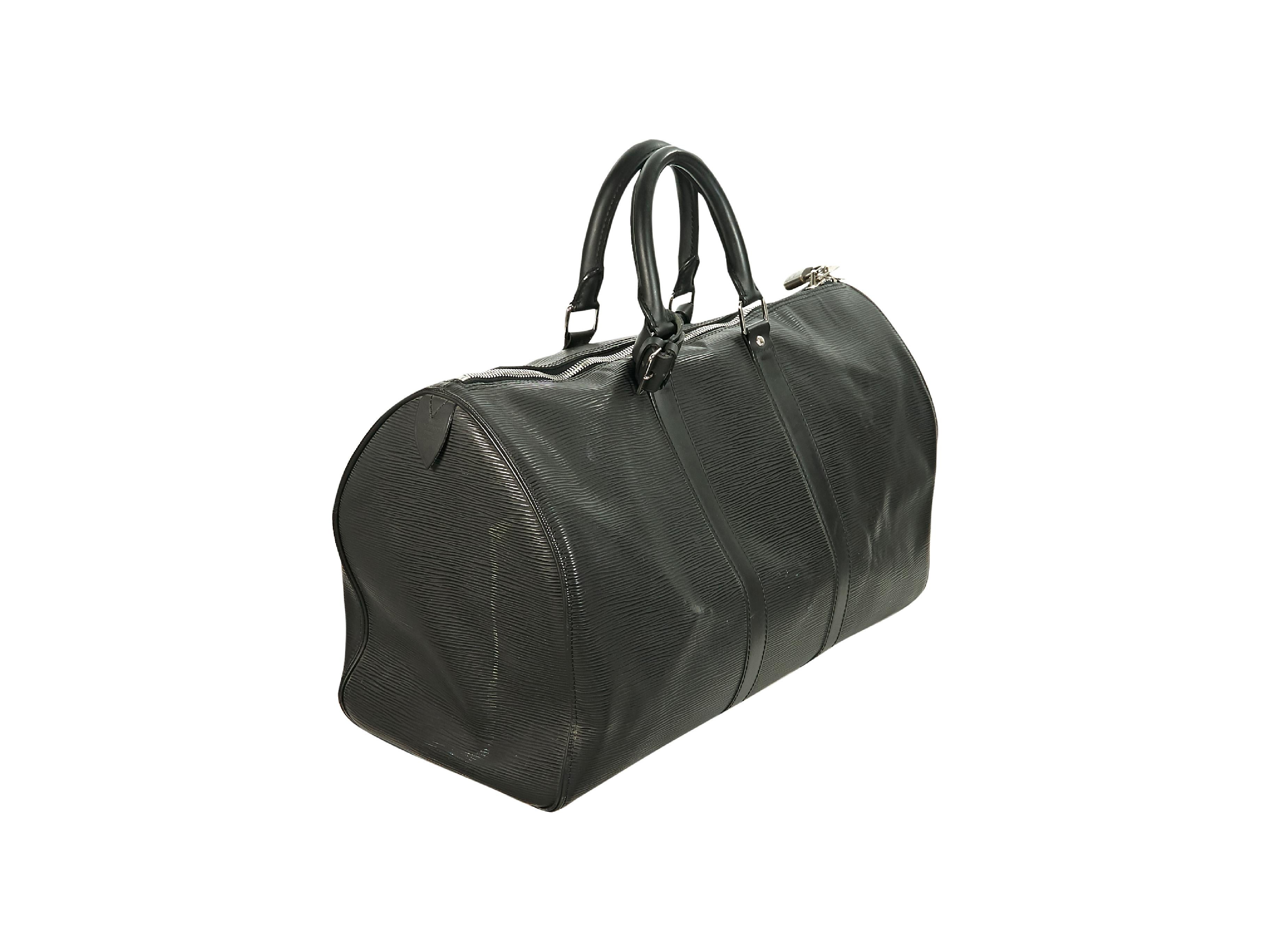 Product details:  Black epi leather Keepall 45 duffle bag by Louis Vuitton.  Dual carry handles.  Top zip closure.  Lined interior.  Exterior slide pocket.  Goldtone hardware.  18.5