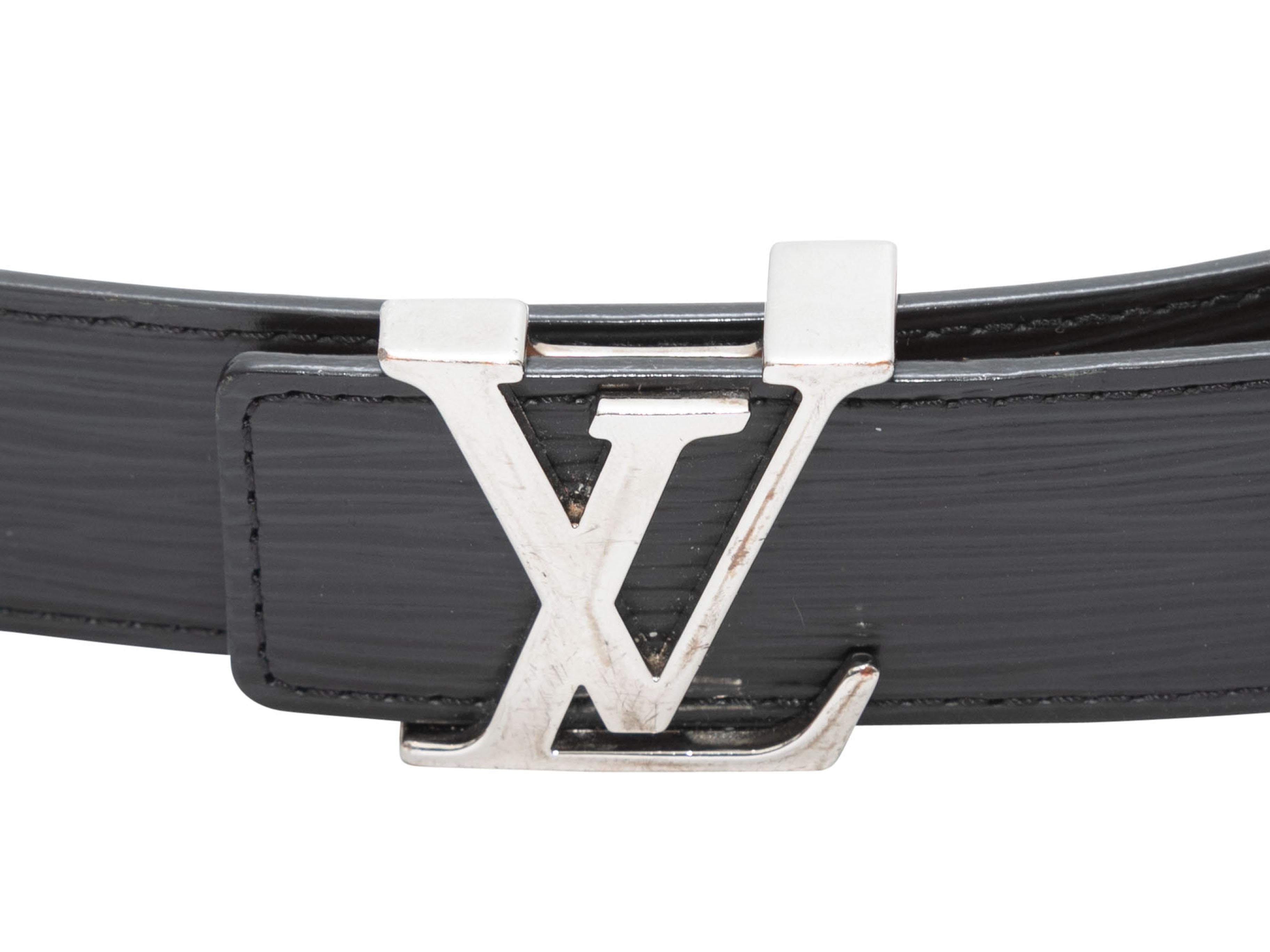 Black Epi leather logo belt by Louis Vuitton. Silver-tone hardware. Peg-in-hole front closure. 1