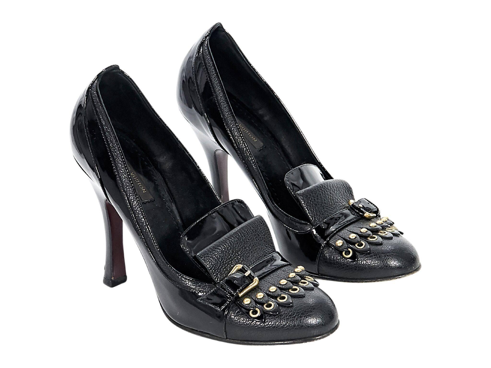 Product details:  Black patent leather heeled ghillie loafer pumps by Louis Vuitton.  Ghillie fringe at vamp accented with studs. Round toe.  Slip-on style.  Goldtone hardware. 
Condition: Pre-owned. Very good. 
Est. Retail $825 