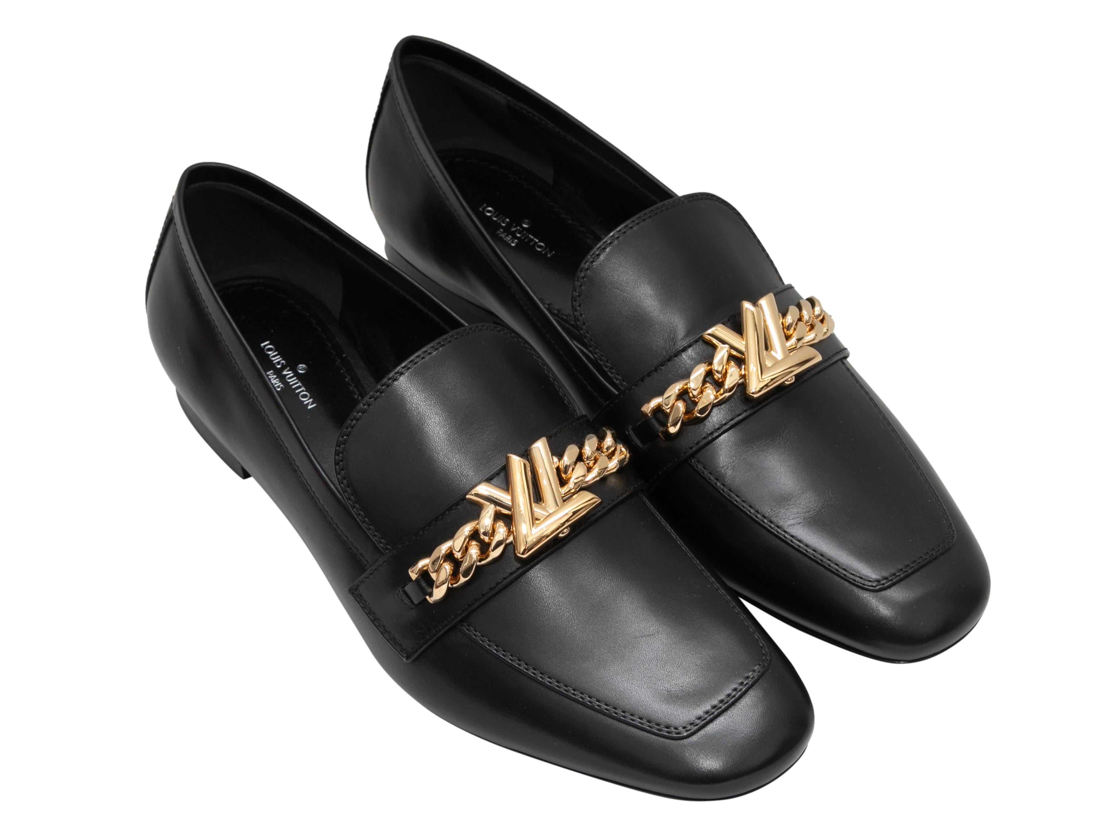 Black leather Upper Case loafers by Louis Vuitton. Gold-tone hardware at tops. 0.25
