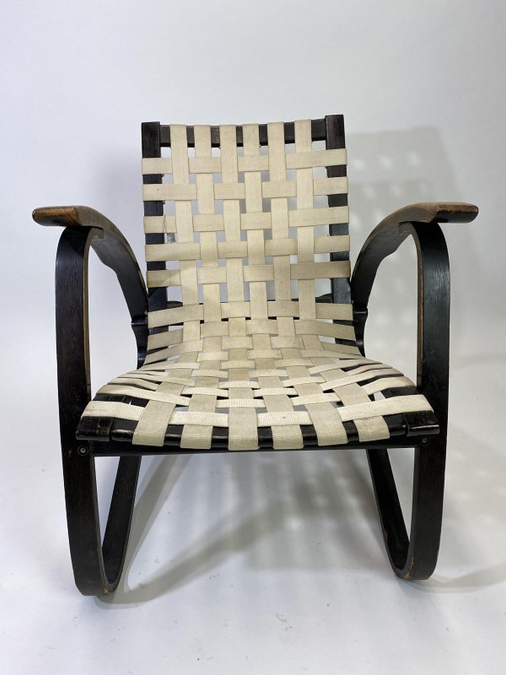 Black bentwood armchair, with white woven original strap seats, designed by Jan Vanek in the 1930s. The armchairs were produced by UP Zavody Brno.