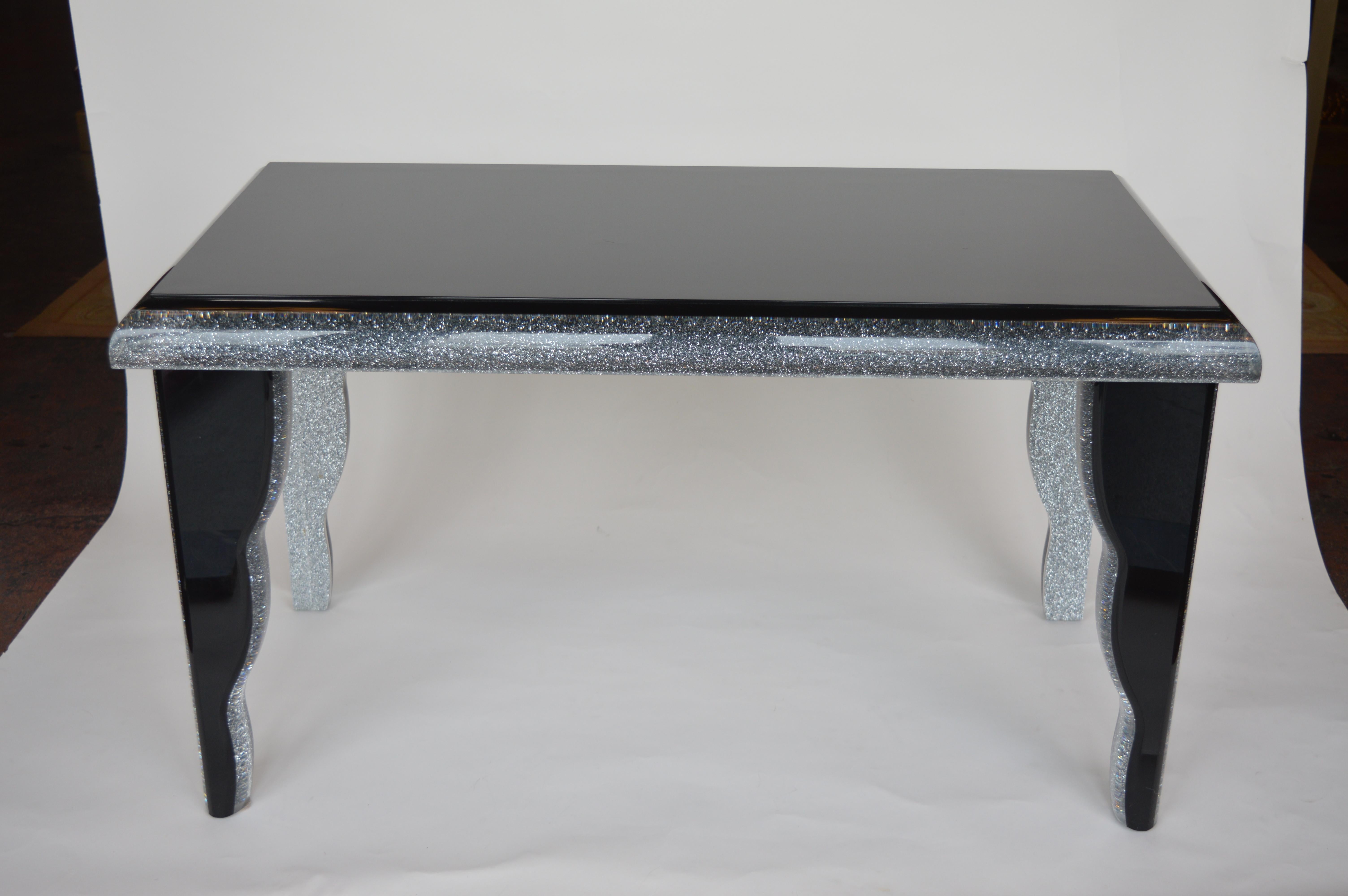 Lucite coffee table with inner trim in silver glitter.