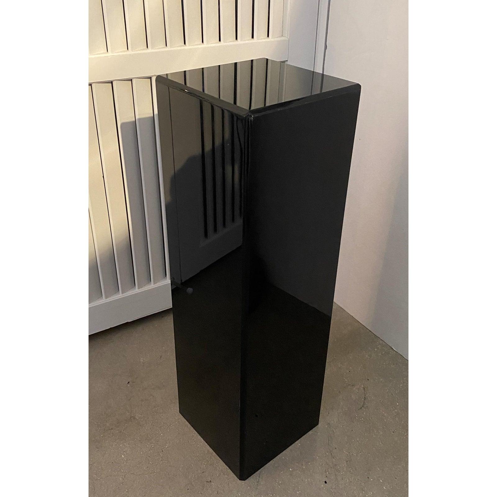 This stylish, small scale black lucite pedestal with its beveled edges was a custom fabrication sometime in the 1990s.