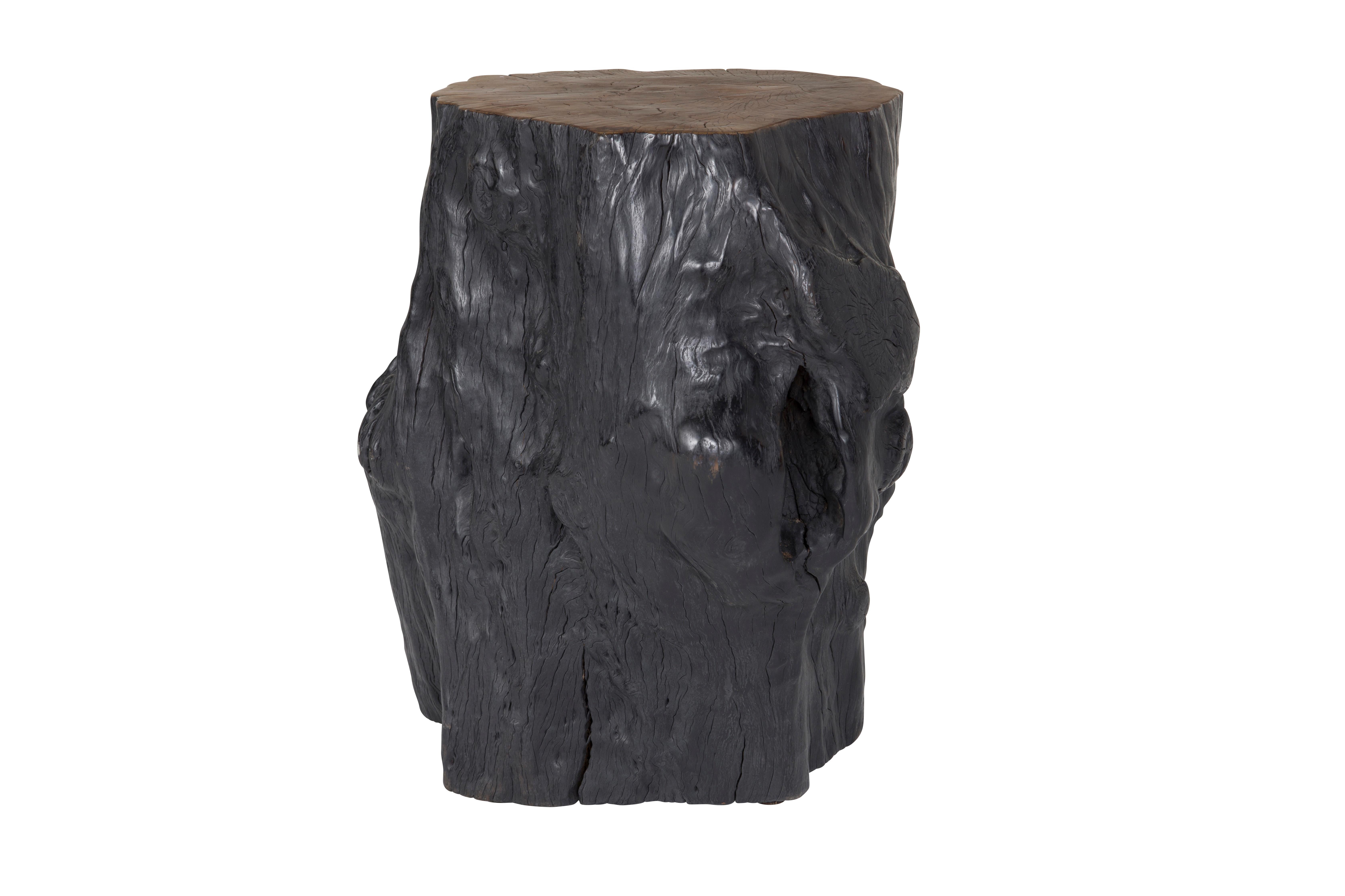 Free-formed organic-shaped lychee wood stump end table. Featuring an ebony-stained body and a warm finished accent top. This hand-carved piece has a smooth top but a natural edge respecting the beautiful grain of the hardwood it comes from.

Our