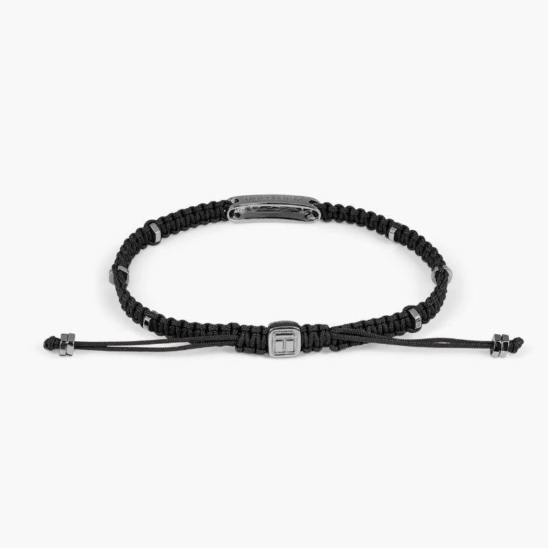 Black Macramé Bracelet with Black Rhodium Baton, Size M

The engravable sterling silver bar is set in black rhodium with black sterling silver disc elements added around the bracelet to give little flashes of light throughout the design. Our