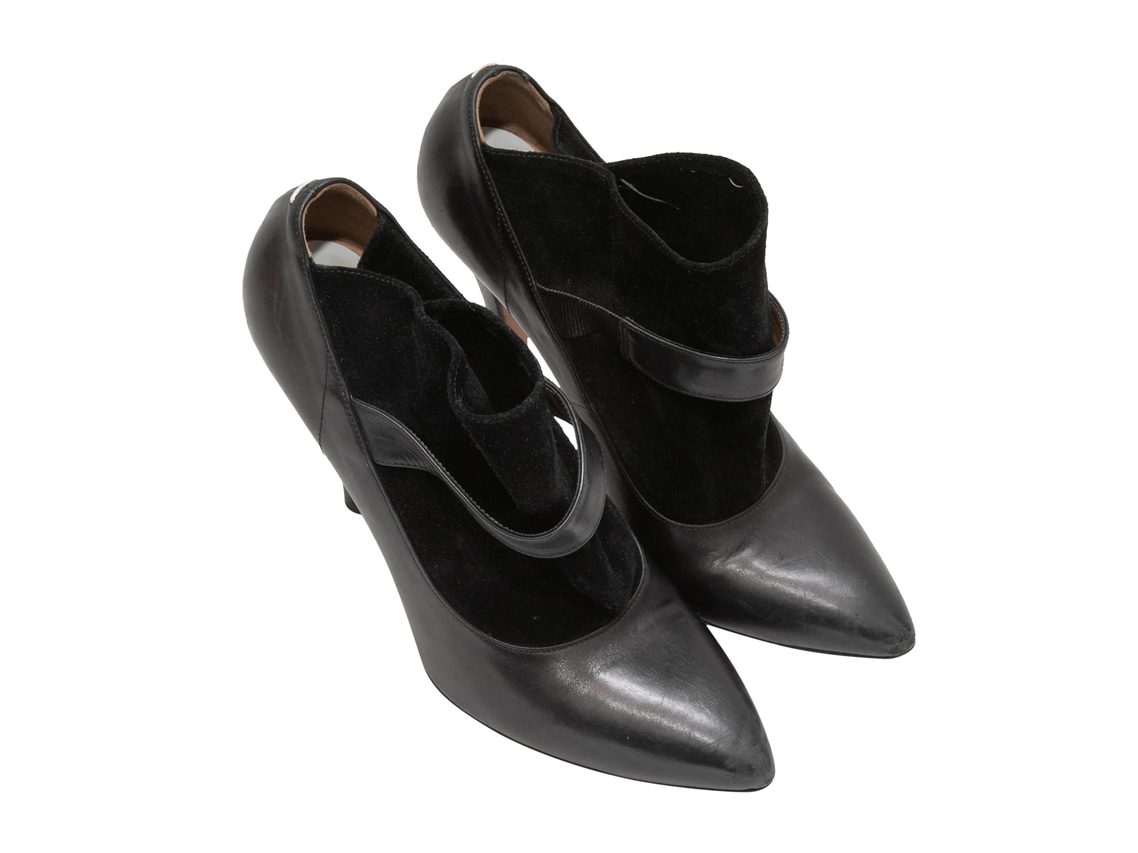 Black leather and suede pointed-toe booties by Maison Margiela Replica. 4.25
