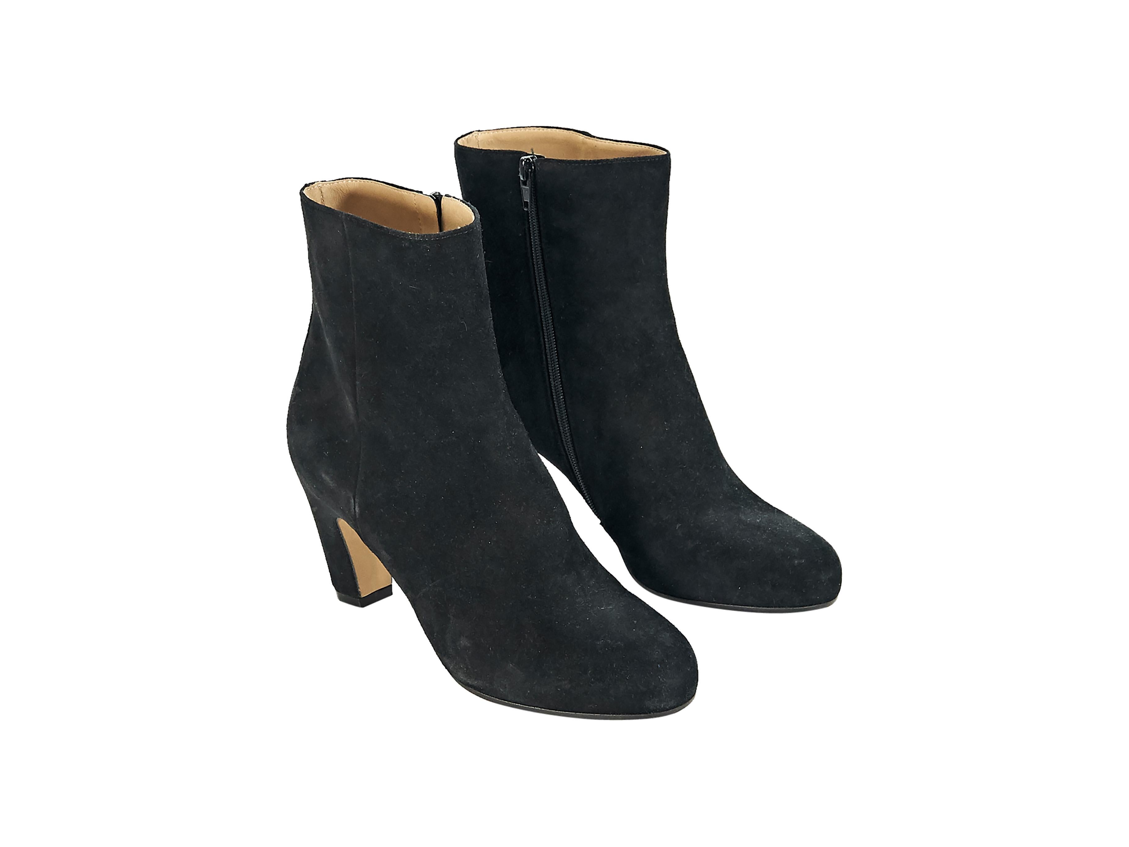 Product details:  Black suede ankle boots by Maison Martin Margiela.  Inner zip closure.  Round toe.  3