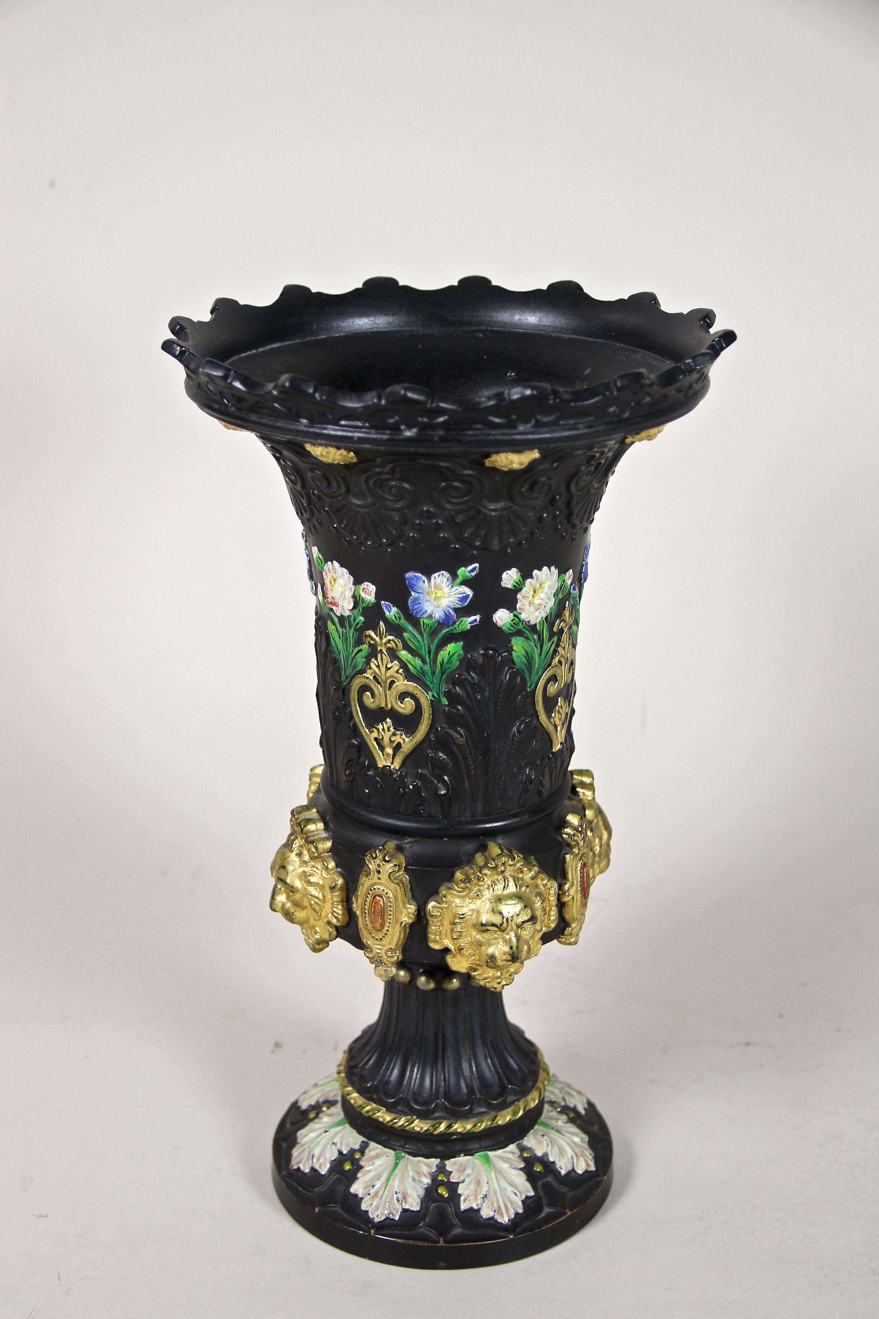 Rare black Majolica Vase with gilt Lion Heads out of the renown workshops of Wilhelm Schiller & Son in Bohemia around 1875. An extraordinary piece of majolica art from the late 19th century, impressing with a goblin-shaped black body adorned by