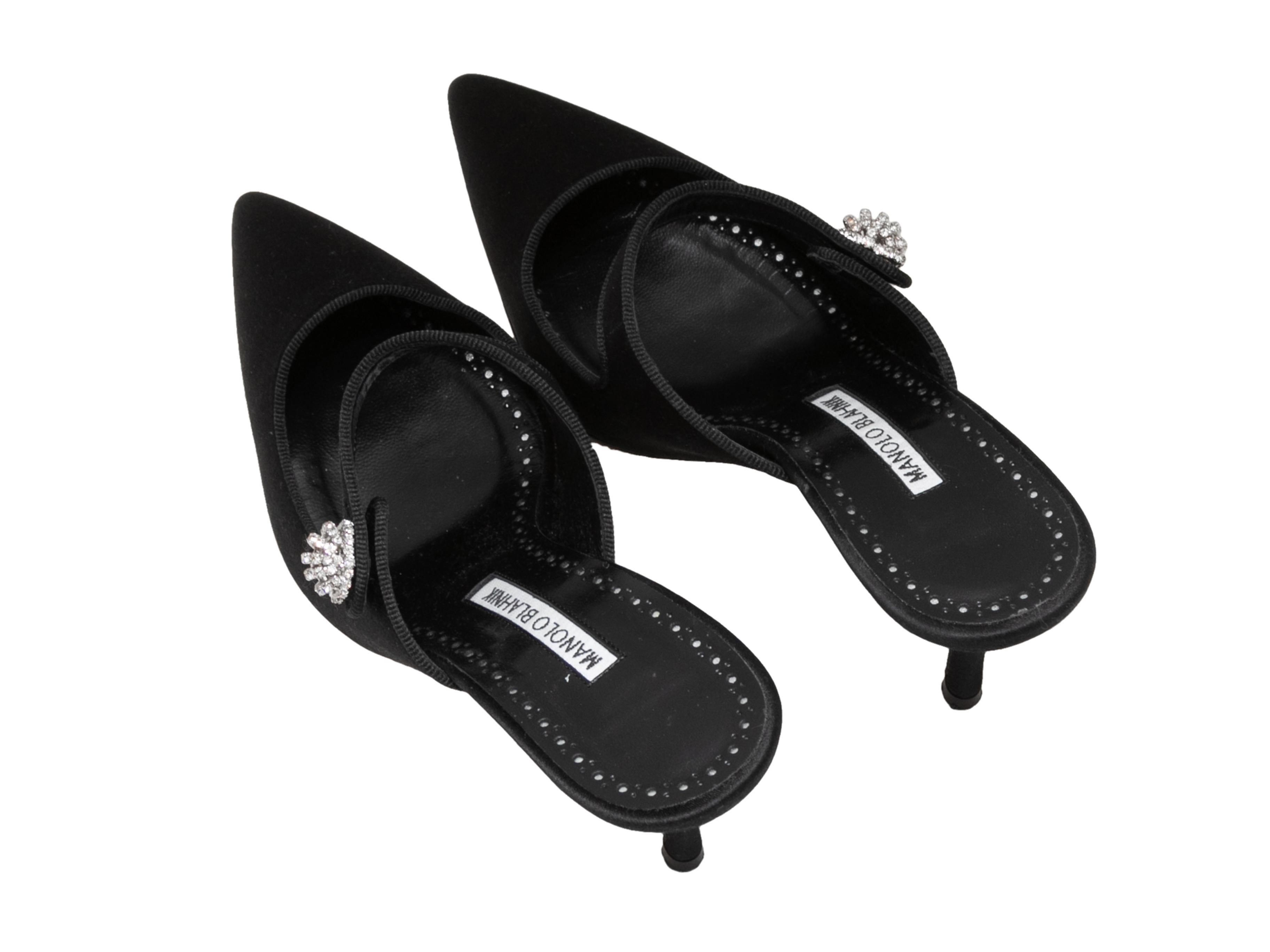 Black satin pointed-toe Mary Jane heeled mules by Manolo Blahnik. Crystal embellishments at straps. 3.5