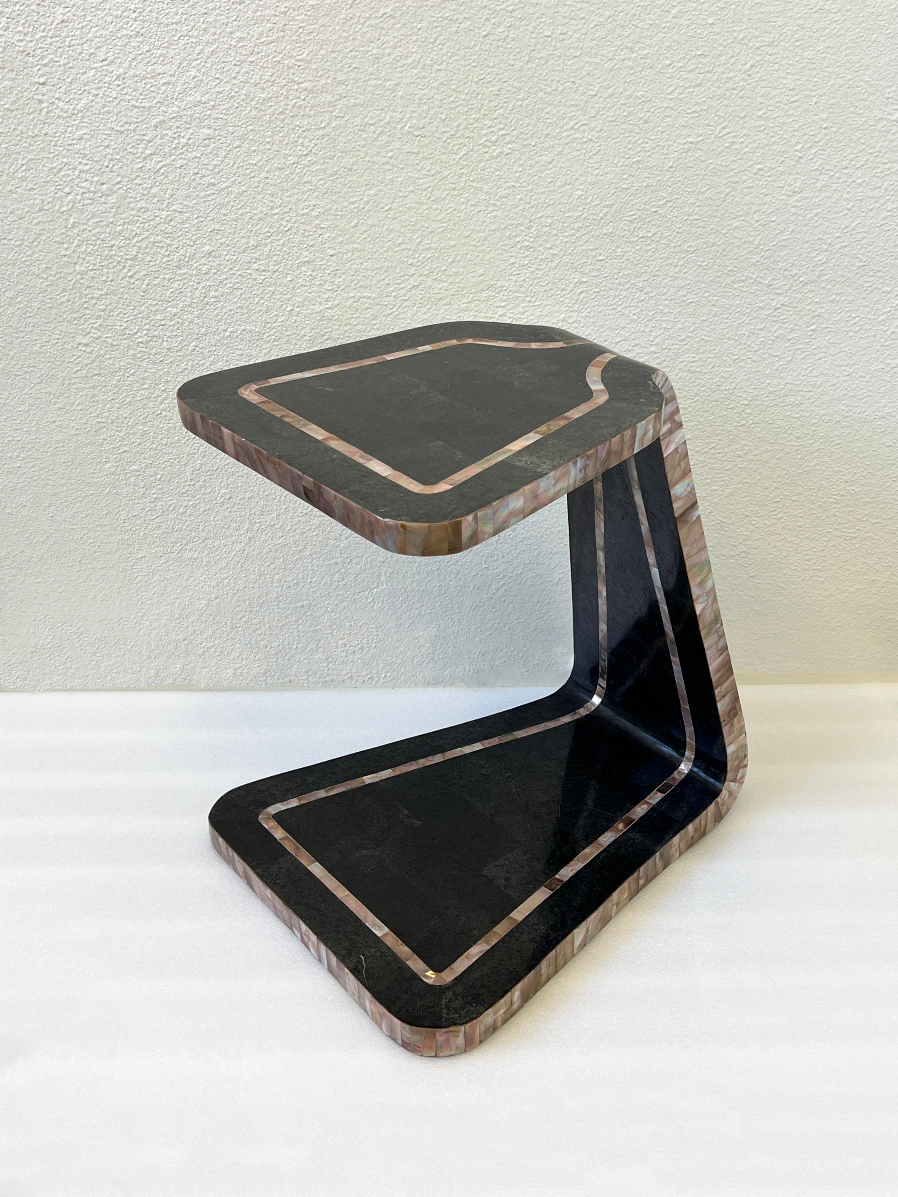 1980’s Sculptural occasional side table by Marquis collection of Beverly Hills. 
Constructed of wood covered with tessellated black marble and pink abalone shell.
Measurements: 19” High, 15” Wide, 18.25” Deep.