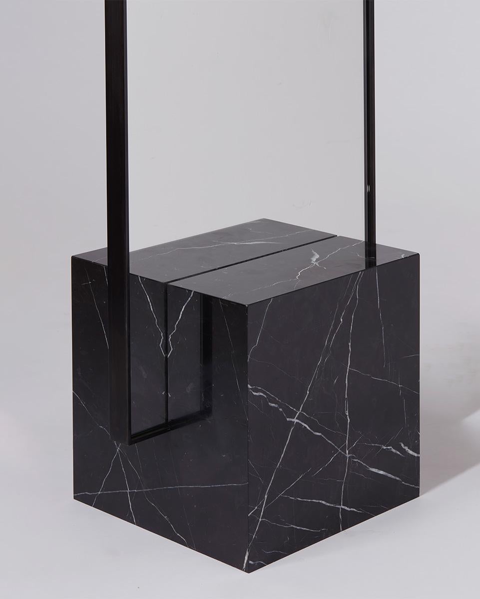Dark Spring coexist standing mirror consists of Nero marquina marble cube base, black steel mirror frame, and recycled rubber.

The black steel framed mirror fits into a rich veined marble cube base with precision. The piece is able to be