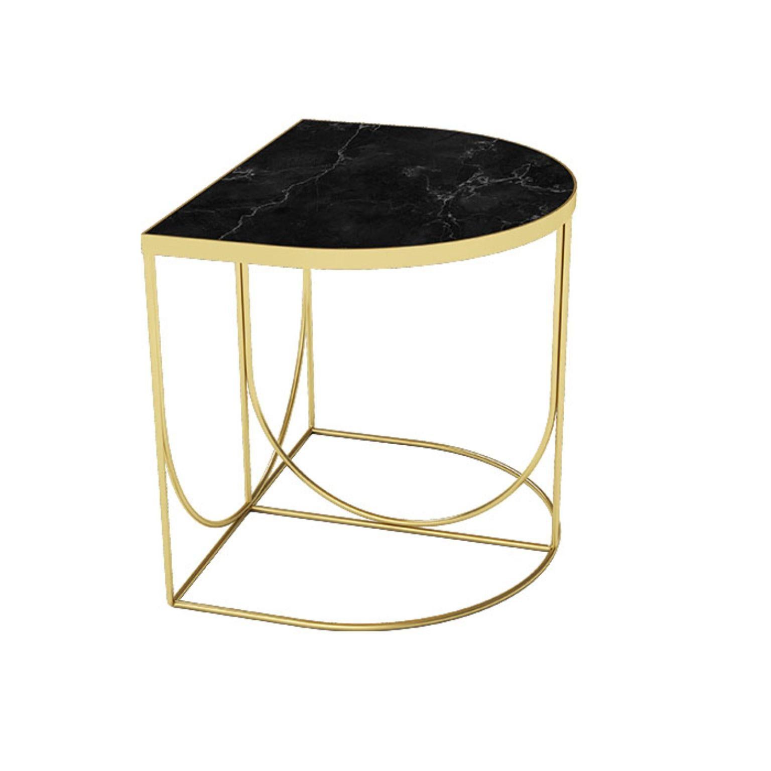 Black marble and gold steel minimalist side table
Dimensions: L 40 x W 50 x H 44,3 CM
Materials: Marble, steel 

This series consists of three different designs that you can combine in many different ways. The table tops come in two different