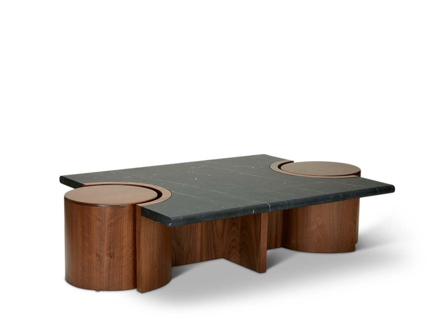 The prospect coffee table features a stone top that rests atop a sculpted American walnut or white oak base with two cutouts for drum tables on either end. 

The Lawson-Fenning Collection is designed and handmade in Los Angeles, California. Reach