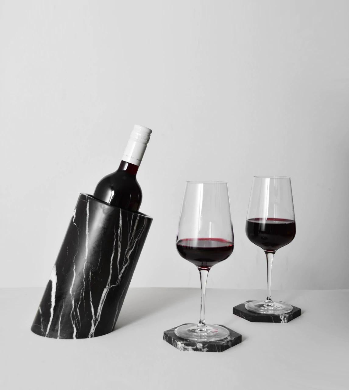 Our wine cooler is designed by us and hand crafted by the artisans within the fair-trade principles.

The natural properties of the marble will keep your wine chilled with no need for ice - you can also place this marble cooler in the fridge for