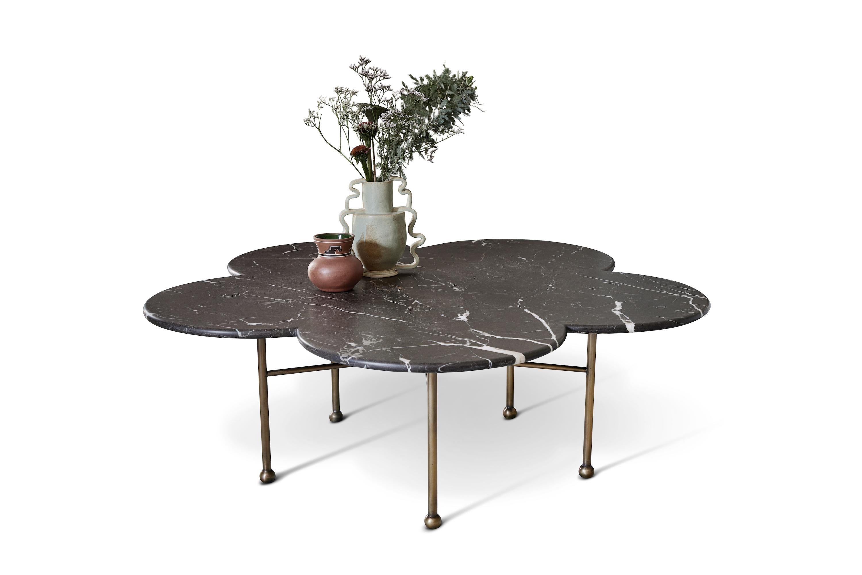 Hand-aged brass pairs with curvilinear black marble in our showstopping Archer Table. Statement essentials make everyday life special & our Archer Table is a room-changer. We love this table in a laidback setting, imparting casual elegance with a