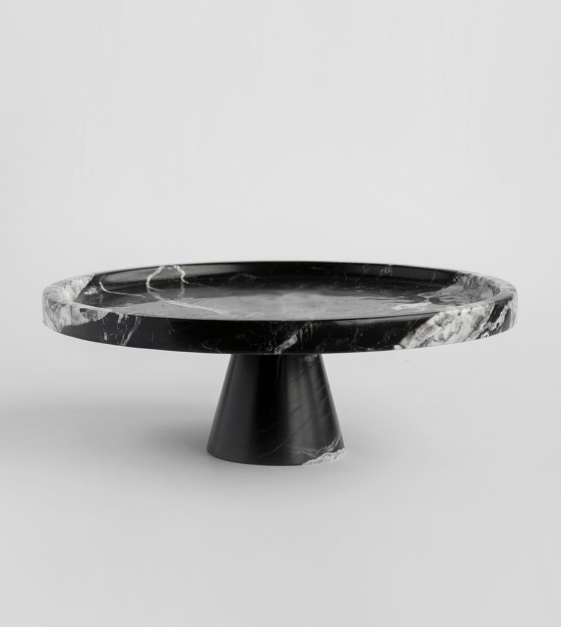 Put your delectable desserts on a pedestal with this gorgeous marble cake stand from Kiwano. Hand crafted by Turkish artisans, this stylish display will ensure your baking skills never go unnoticed. Glass dome not included. 

There may be natural