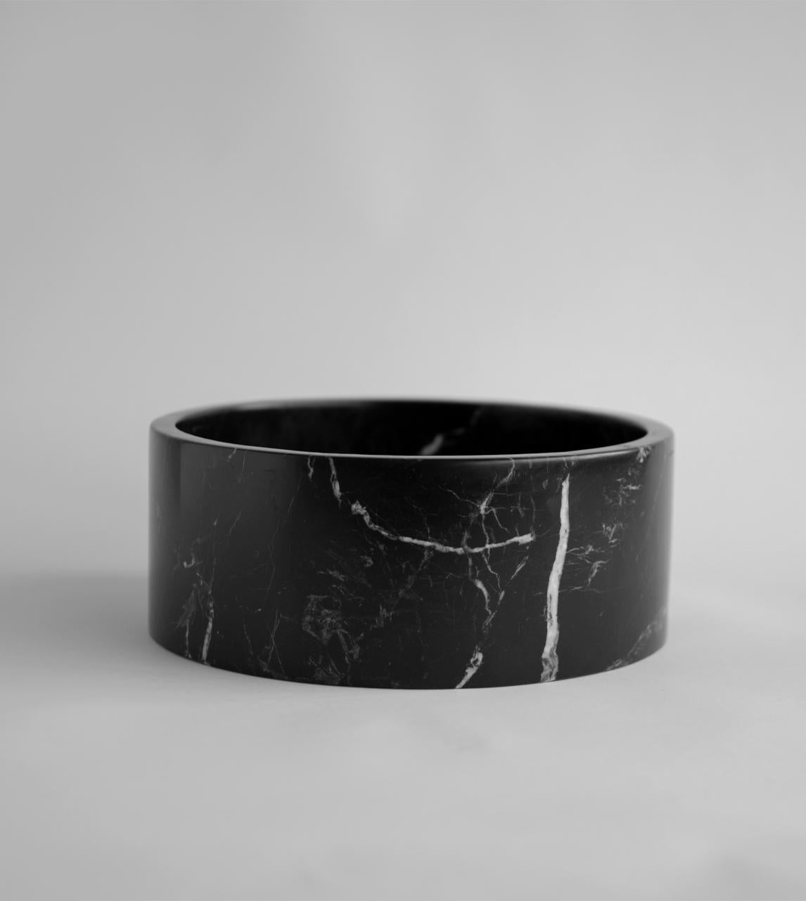 This substantial black marble bowl is beautifully handcrafted from a single piece of genuine Turkish Black Marble and honed for a silky mat finish. 

There may be natural variations that are not product flaws, they make your design truly