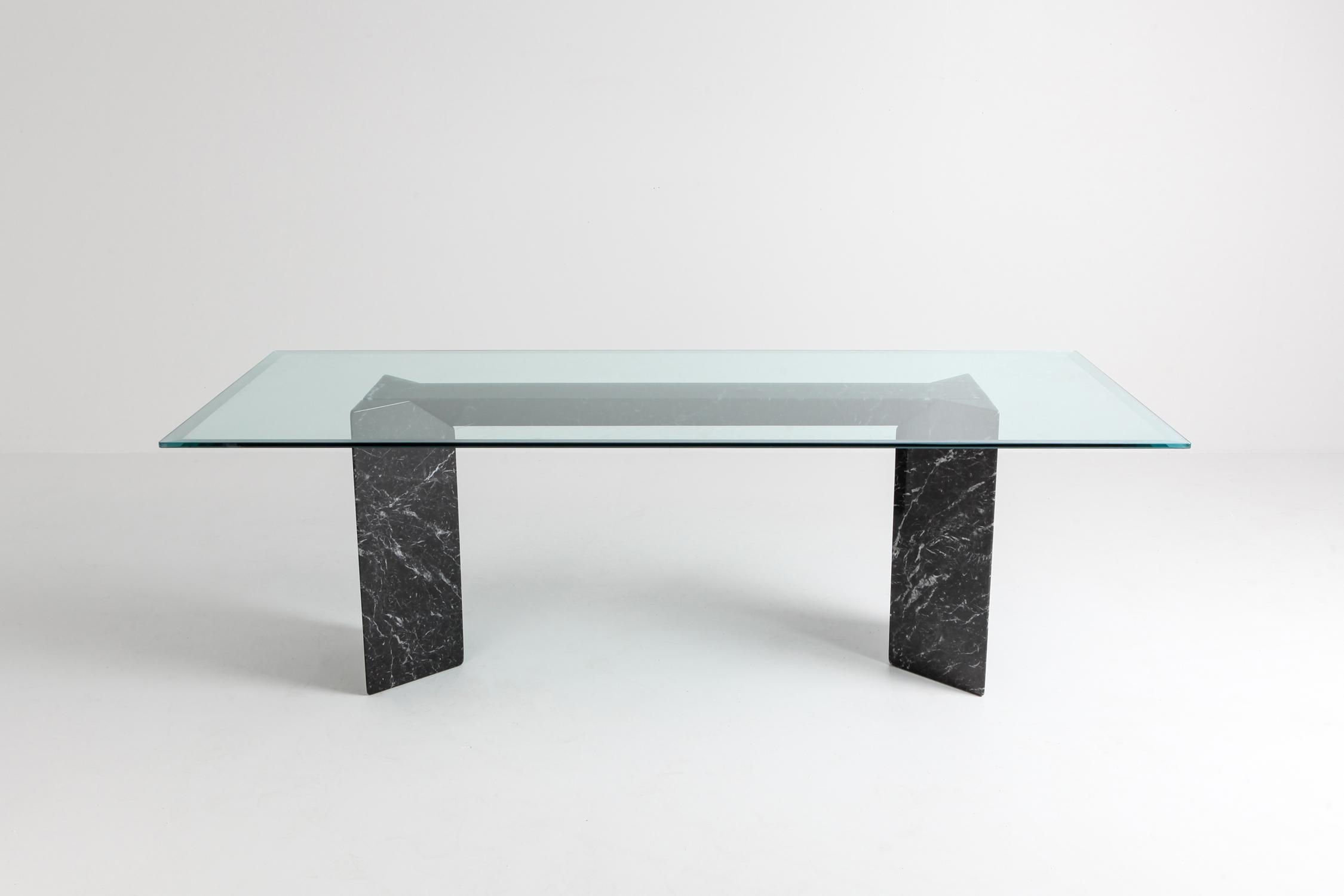 Post-modern dining table in nero Marquita marble with glass top
by Lazzotti for Up&Up
Italy, 1990s
The two marble columns can be randomly placed to support the beam.
A nice detail are the sandblasted edges on the glass top
In the style of