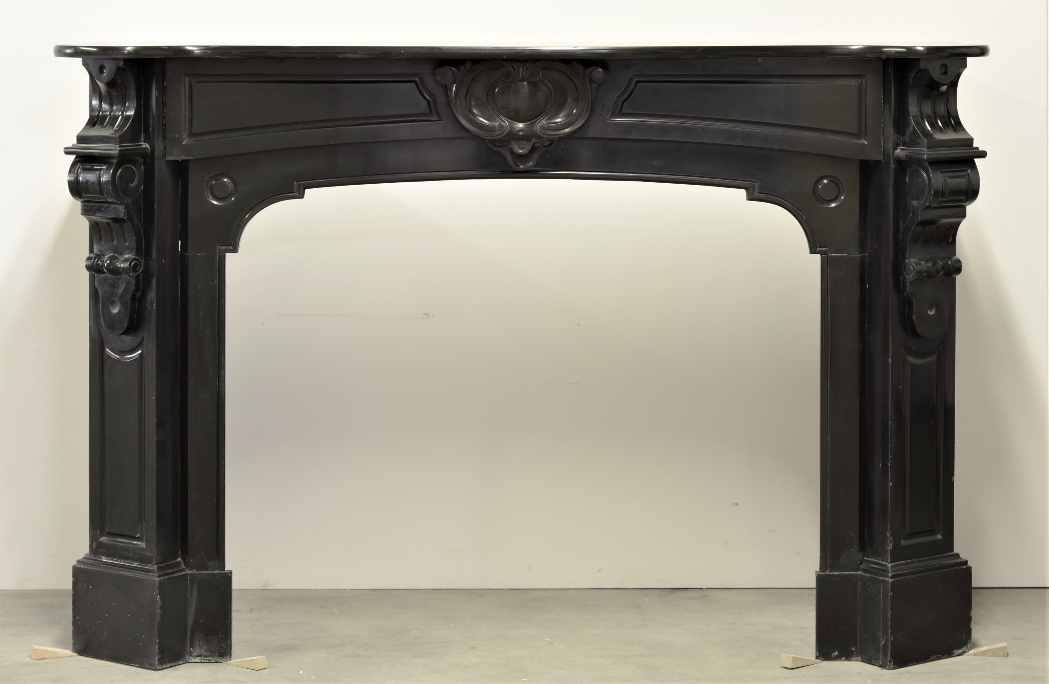 Nice antique Louis XV style marble fireplace in Noir de Mazy marble from Belgium, the beautiful deep black marble give it the perfect soft shine. 

Great original condition, ready to be crated, shipped and installed!

Sold by Schermerhorn