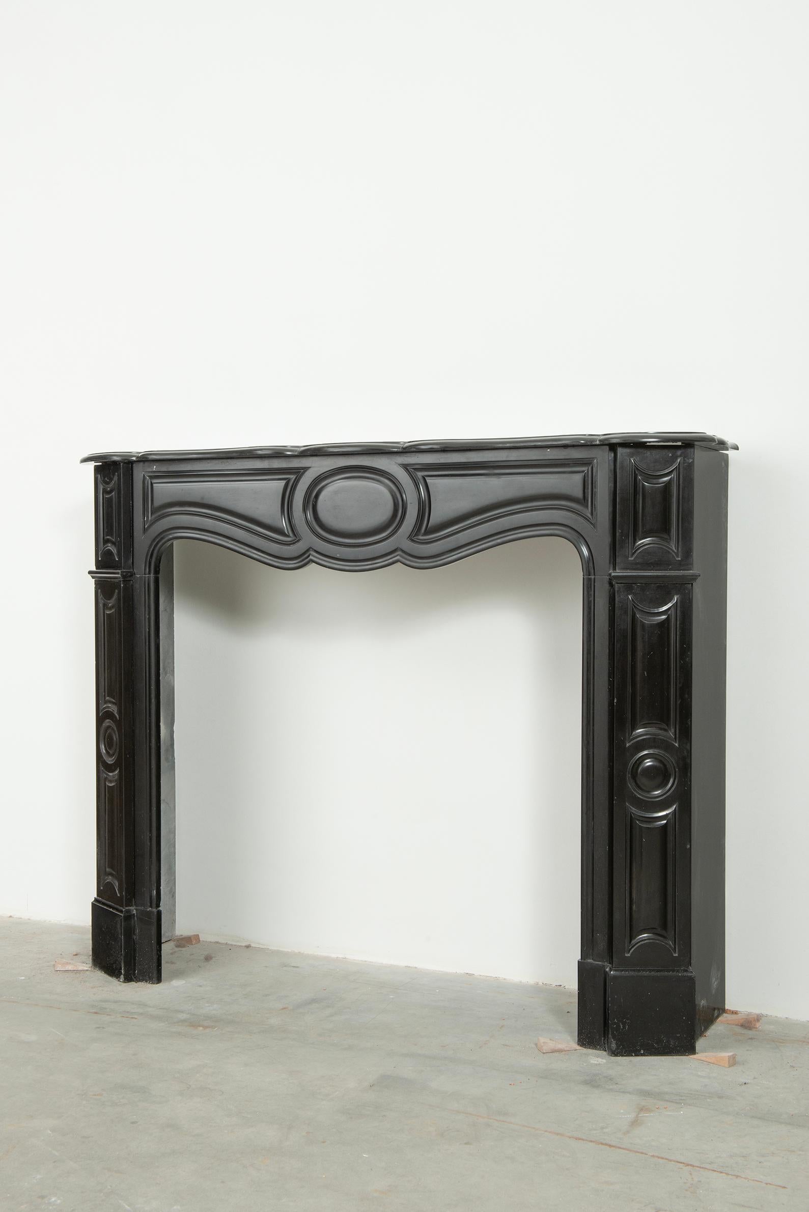 French Black Marble Louis XV Fireplace Mantel For Sale
