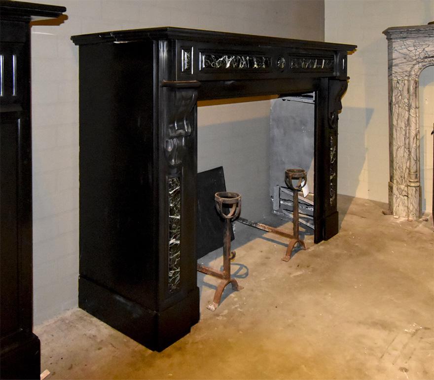 A nice Black marble Noir de Mazy fireplace mantle with grey/green imposed 
from the 19th Century. Comes from the Netherlands.
To place around the chimney.