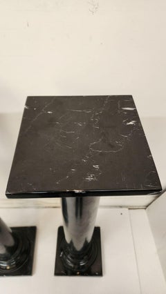 Black marble pedestals